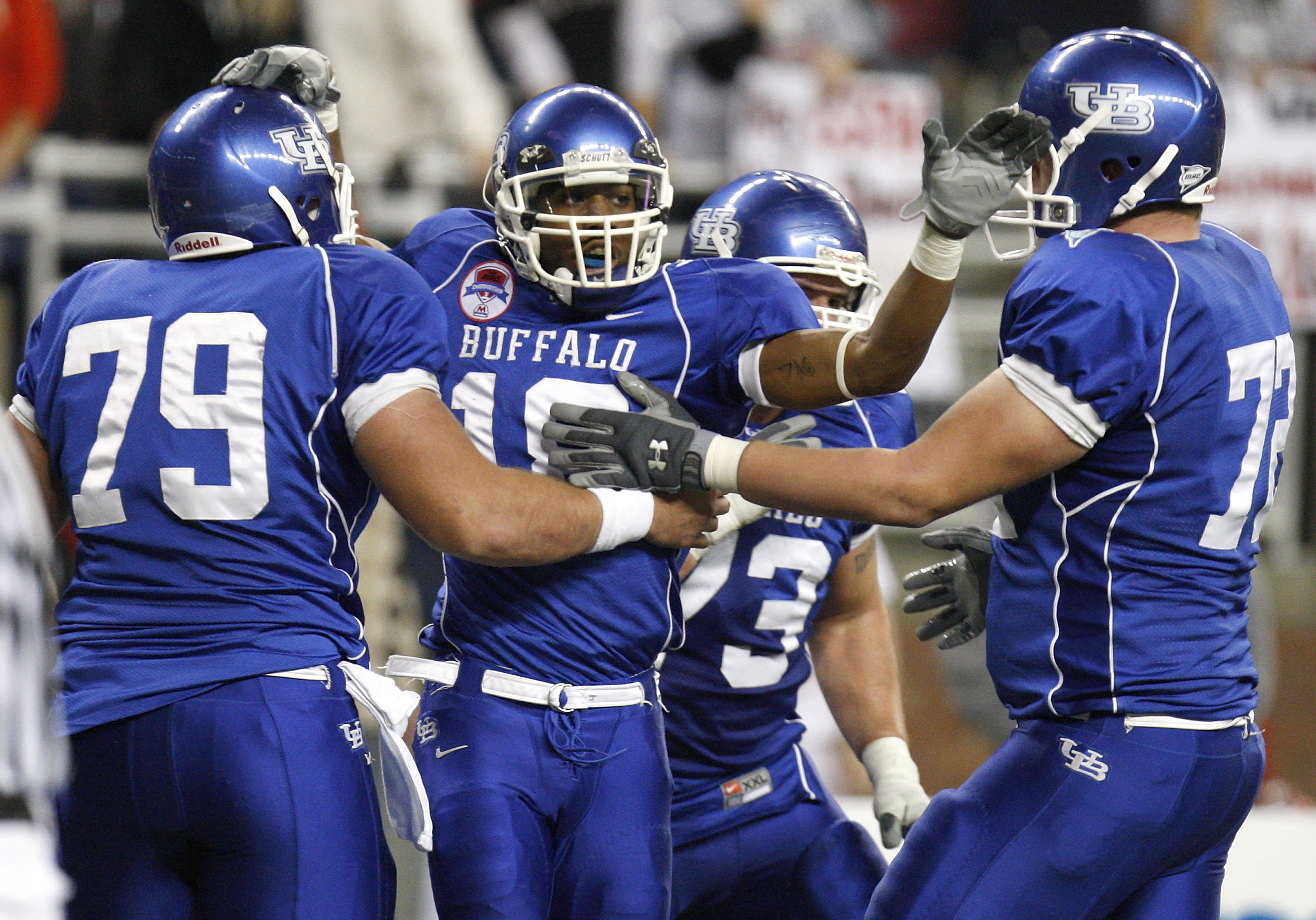 DETROIT - DECEMBER 05: James Starks #19 of the Buffalo Bulls celebrates a fourth quarter touchdown with Chris Lauzze #79, Andrew West #72 and Peter Bittner #73 while playing the Ball State Cardinals during the second quarter of the MAC Championship game o
