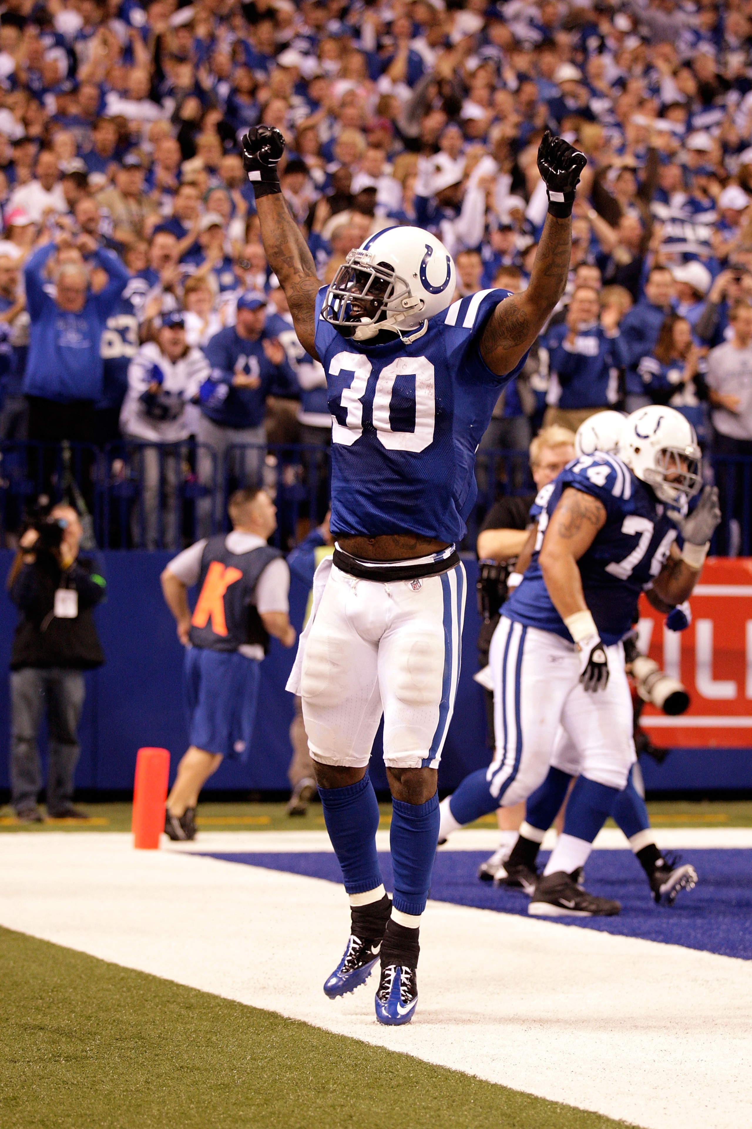 INDIANAPOLIS, IN - JANUARY 08:  Dominic Rhodes #30 of the Indianapolis Colts celebrates after Pierre Garcon #85 scored a 57-yard touchdown reception in the second quarter against the New York Jets during their 2011 AFC wild card playoff game at Lucas Oil