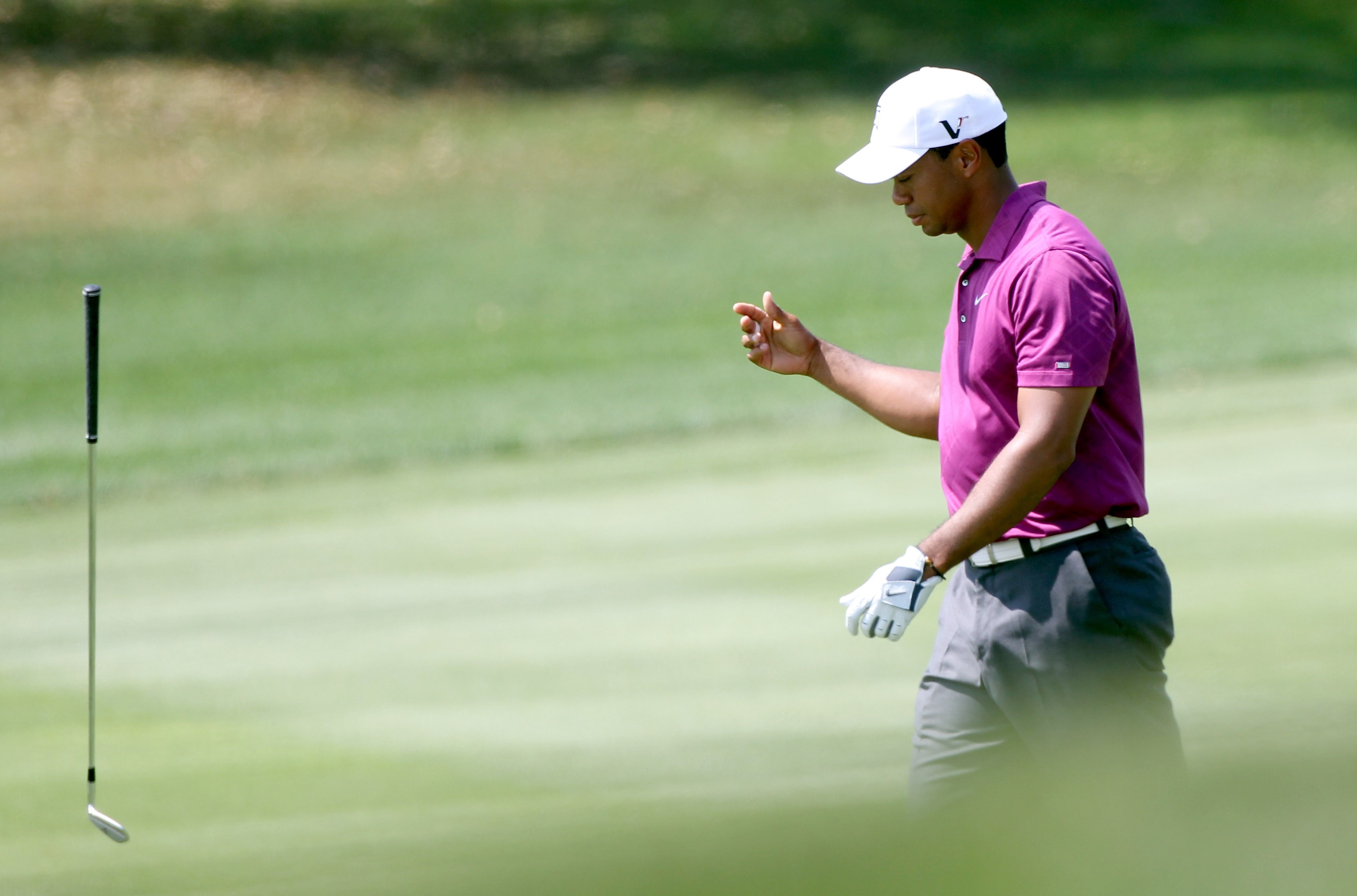 ORLANDO, FL - MARCH 26:  Tiger Woods tosses a club on the 5th hole during the third round of the Arnold Palmer Invitational presented by MasterCard at the Bay Hill Club and Lodge on March 26, 2011 in Orlando, Florida.  (Photo by Sam Greenwood/Getty Images