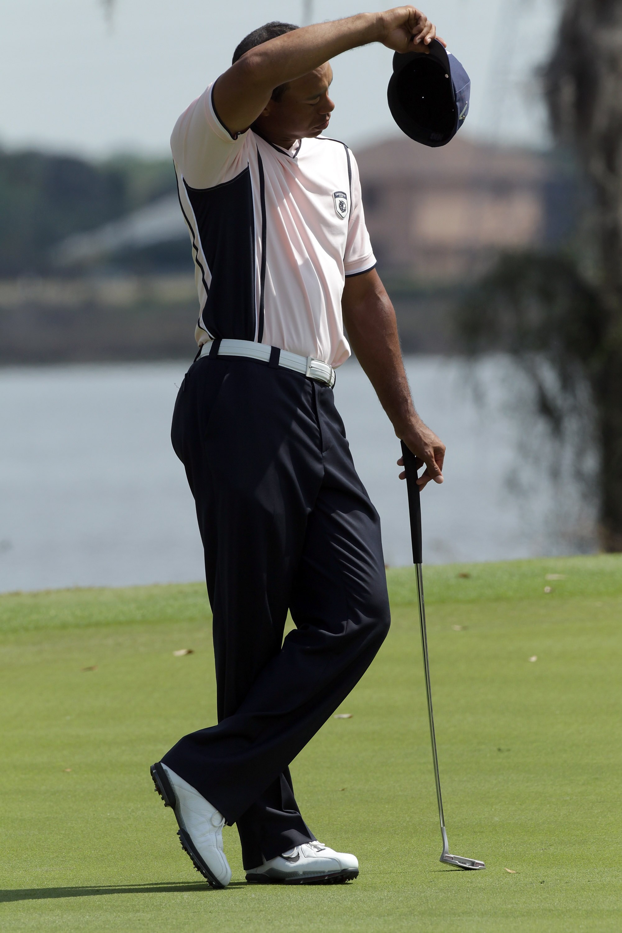 WINDERMERE, FL - MARCH 15:  Tiger Woods of the USA on the 9th hole during the second day of the 2011 Tavistock Cup at Isleworth Golf and Country Club on March 15, 2011 in Windermere, Florida.  (Photo by David Cannon/Getty Images)