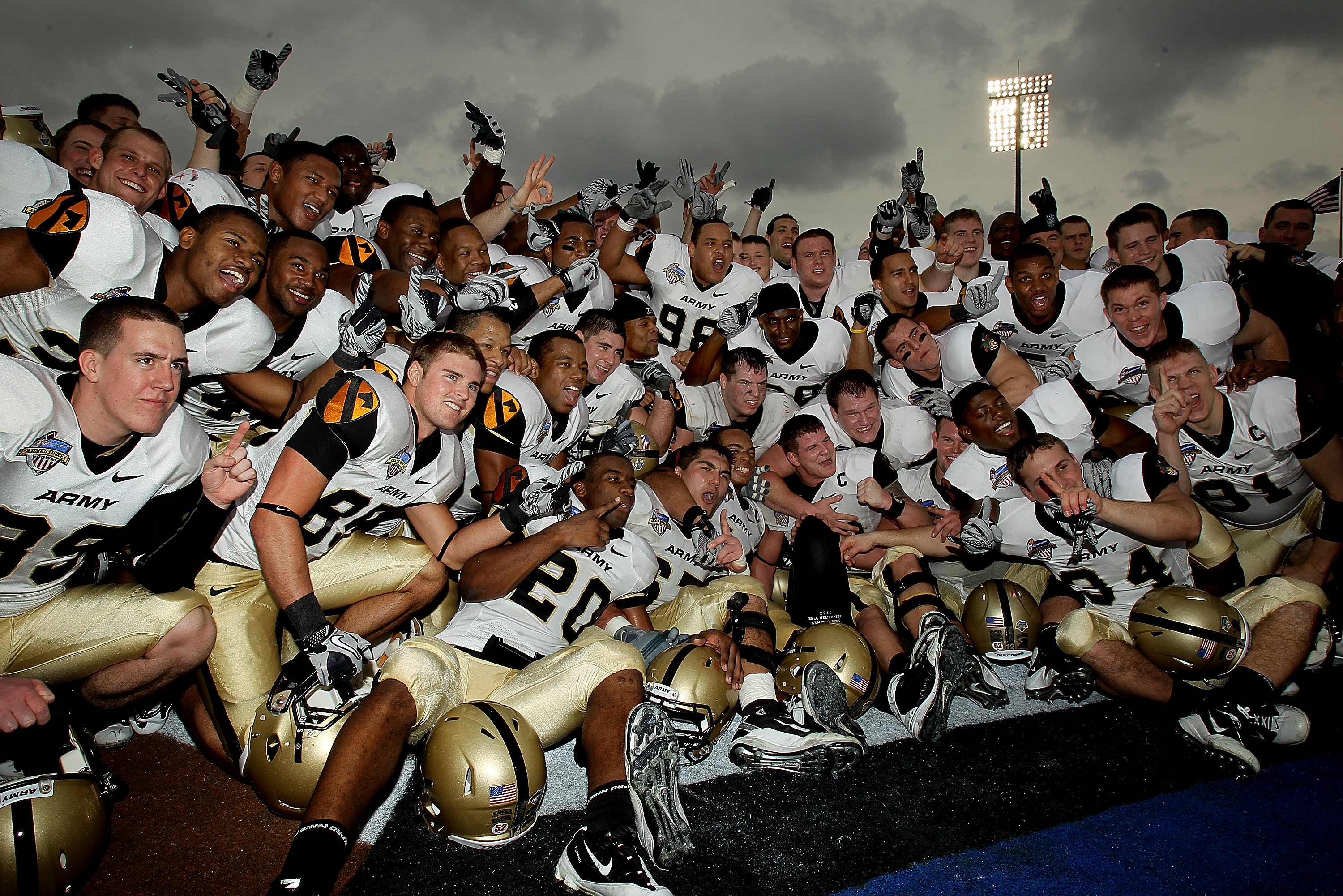 DALLAS, TX - DECEMBER 30:  The Army Black Knights celebrate a 16-14 win against the SMU Mustangs during the Bell Helicopter Armed Forces Bowl at Gerald J. Ford Stadium on December 30, 2010 in Dallas, Texas.  (Photo by Ronald Martinez/Getty Images)