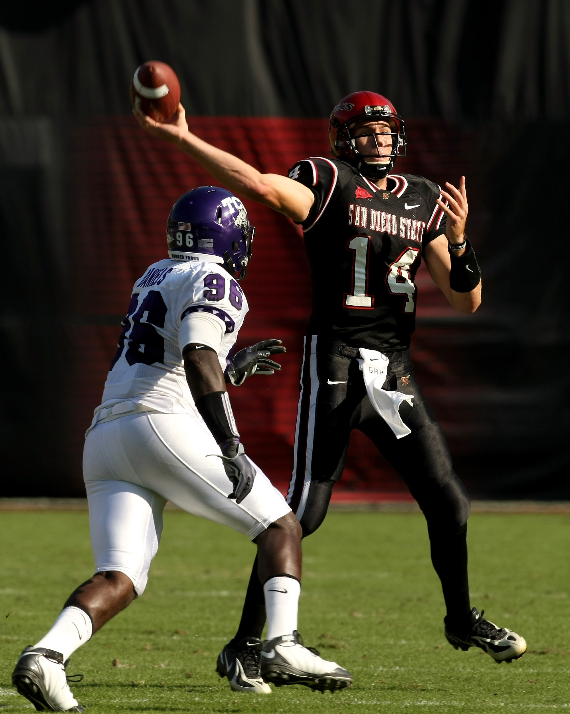 SAN DIEGO - NOVEMBER 7:  Quarterback Ryan Lindley #14 of the San Diego State Aztecs throws a pass over defensive end Wayne Daniels #96 of the Texas Christian University Horned Frogs on November 7, 2009 at Qualcomm Stadium in San Diego, California.    (Pho