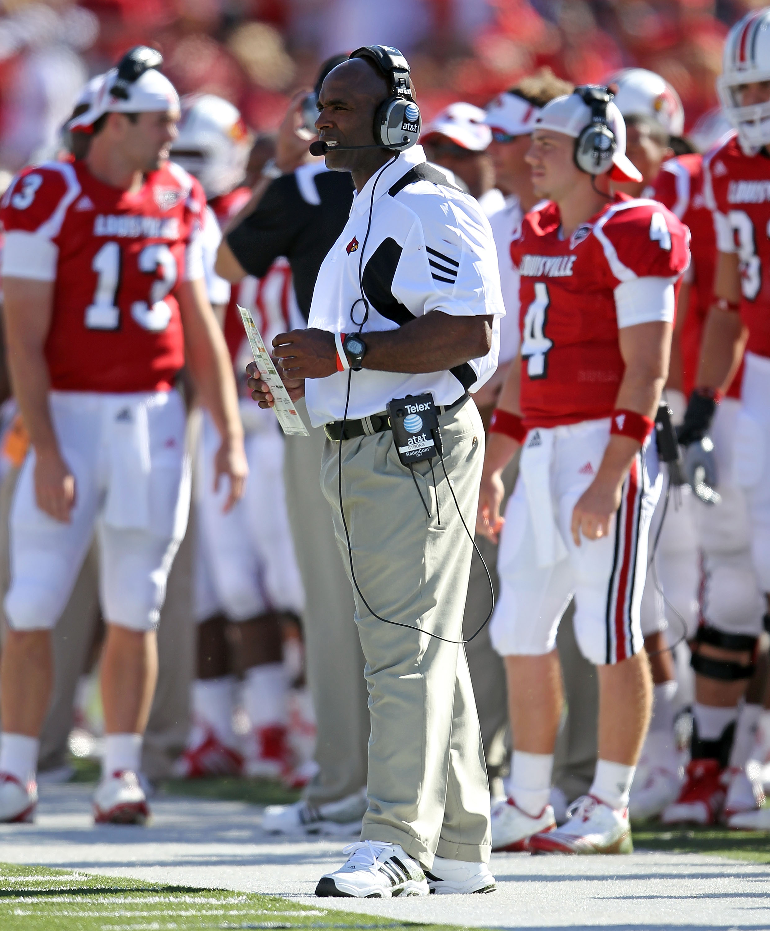 LOUISVILLE, KY - SEPTEMBER 04: Charlie Strong the Head Coach of the Louisville Cardinals gives instructions to his team during the game against the  Kentucky Wildcats at Papa John's Cardinal Stadium on September 4, 2010 in Louisville, Kentucky.  (Photo by
