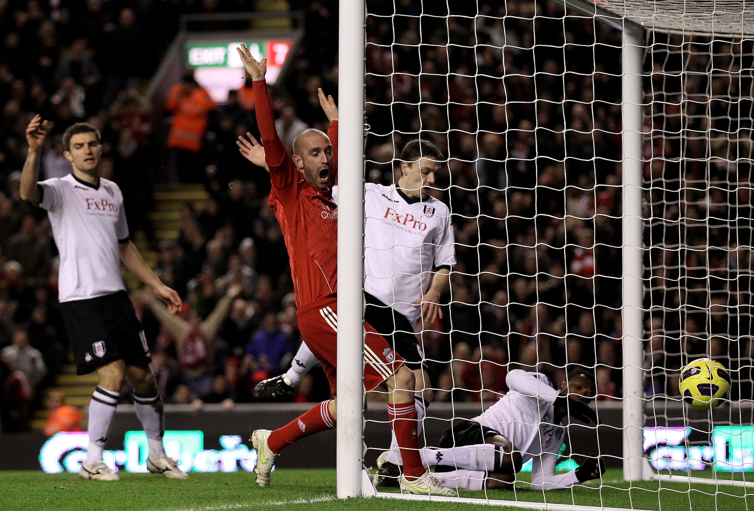 LIVERPOOL, ENGLAND - JANUARY 26:  Raul Meireles of Liverpool celebrates as John Pantsil of Fulham scores an own goal during the Barclays Premier League match between Liverpool and Fulham at Anfield on January 26, 2011 in Liverpool, England. (Photo by Alex