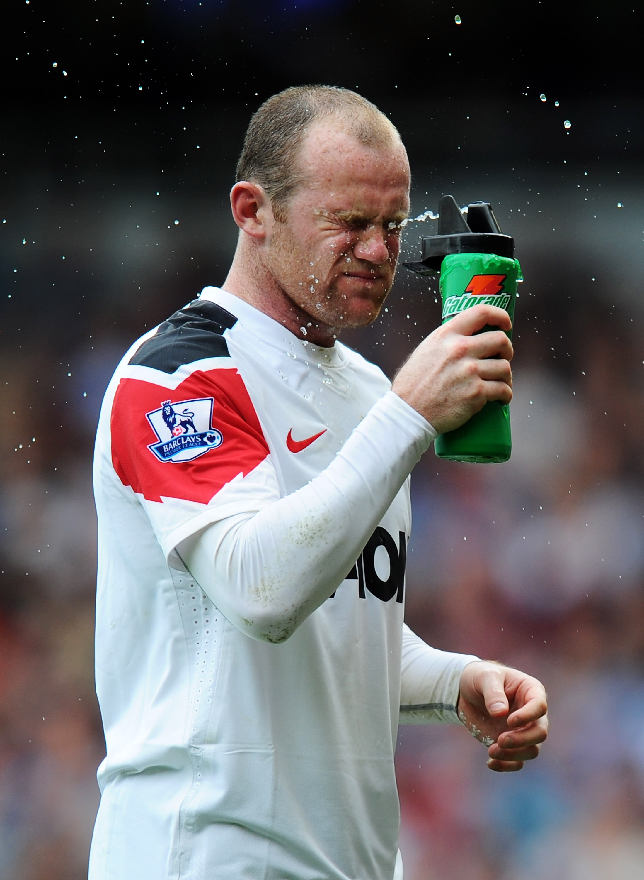 LONDON, ENGLAND - APRIL 02:  Wayne Rooney of Manchester United feels the heat during the Barclays Premier League match between West Ham United and Manchester United at the Boleyn Ground on April 2, 2011 in London, England.  (Photo by Mike Hewitt/Getty Ima
