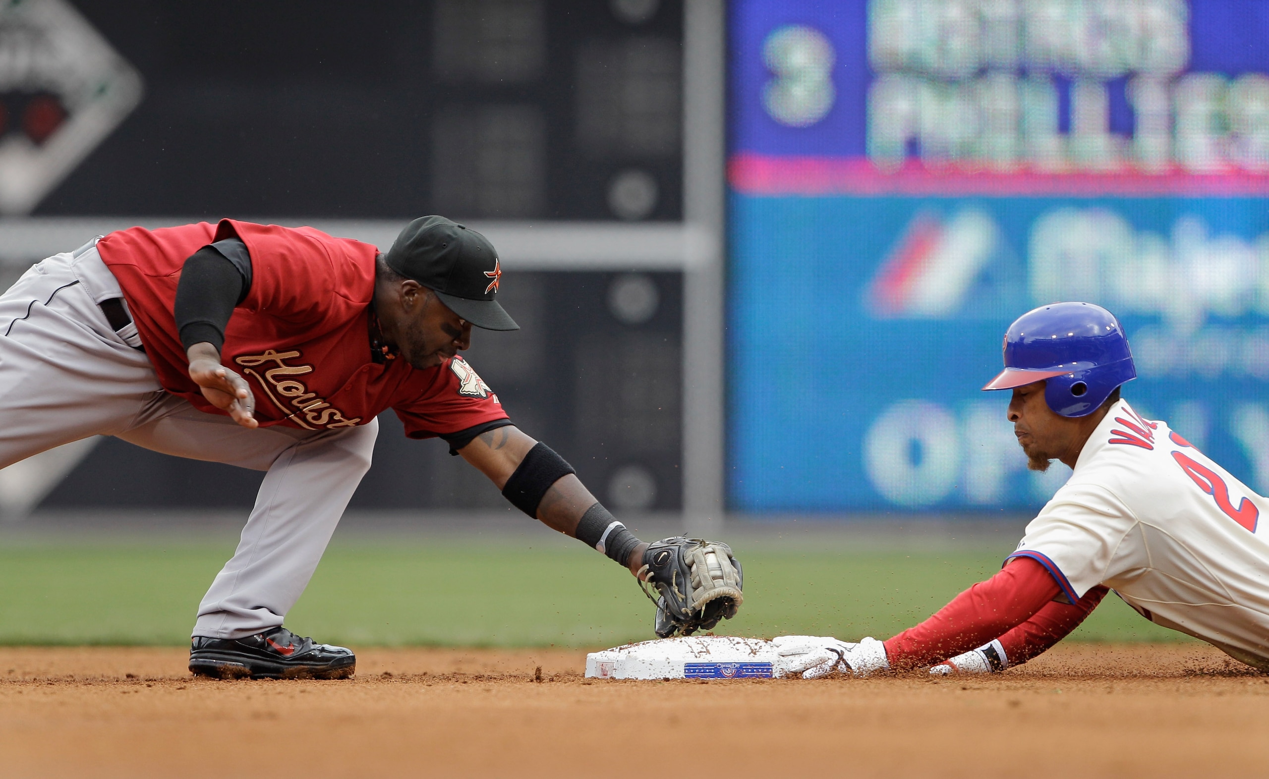 PHILADELPHIA, PA - APRIL 01: Second baseman Bill Hall #22 of the Houston Astros applies the late tag as Wilson Valdez #21 of the Philadelphia Phillies slides safely into the bag for a double during the third ininng at Citizens Bank Park on April 1, 2011 i PHILADELPHIA, PA - APRIL 01: Second baseman Bill Hall #22 of the Houston Astros applies the late tag as Wilson Valdez #21 of the Philadelphia Phillies slides safely into the bag for a double during the third ininng at Citizens Bank Park on April 1, 2011 i