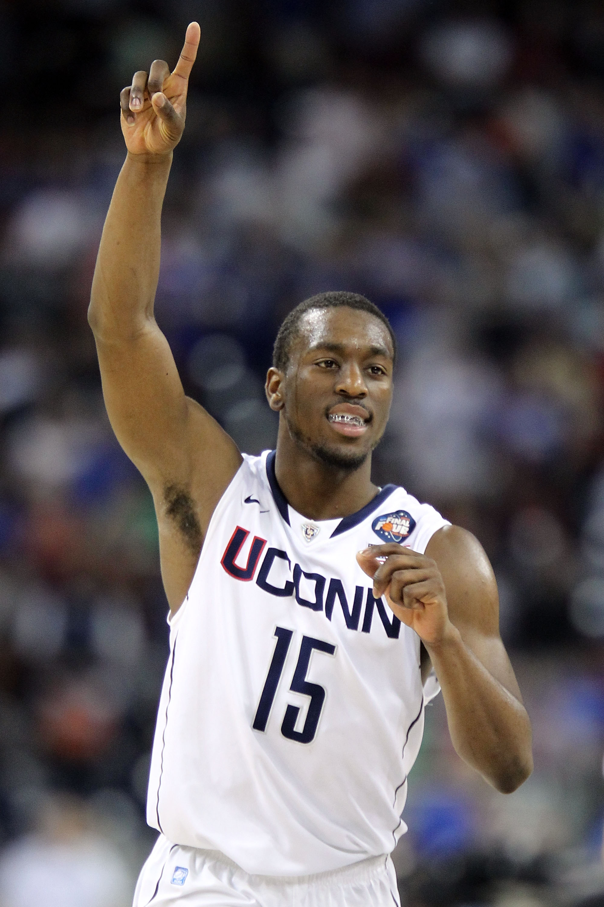 HOUSTON, TX - APRIL 02: Kemba Walker #15 of the Connecticut Huskies reacts towards the end of the game against the Kentucky Wildcats during the National Semifinal game of the 2011 NCAA Division I Men's Basketball Championship at Reliant Stadium on April