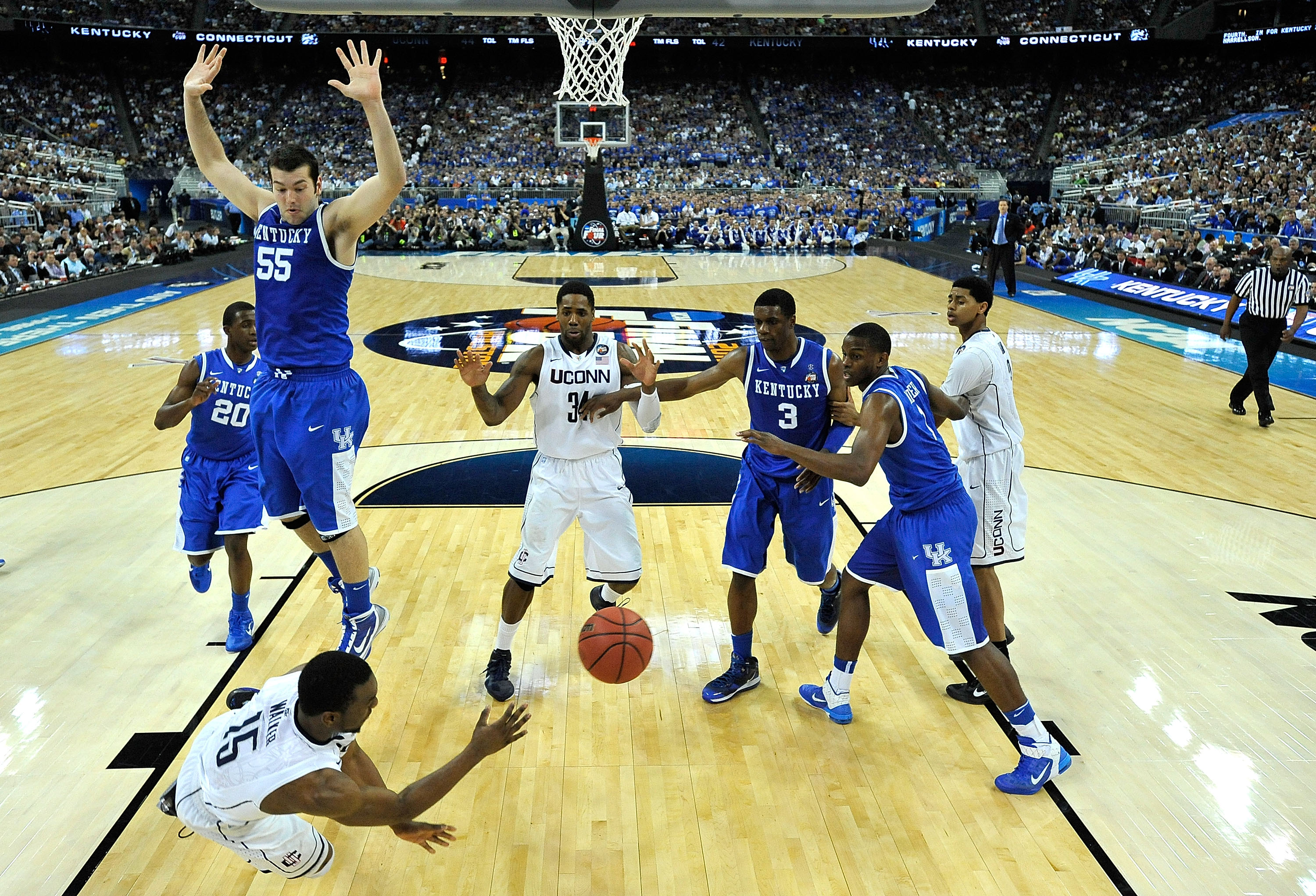 HOUSTON, TX - APRIL 02: Kemba Walker #15 of the Connecticut Huskies dives to save a ball from going out of bounds against the Kentucky Wildcats during the National Semifinal game of the 2011 NCAA Division I Men's Basketball Championship at Reliant Stadiu