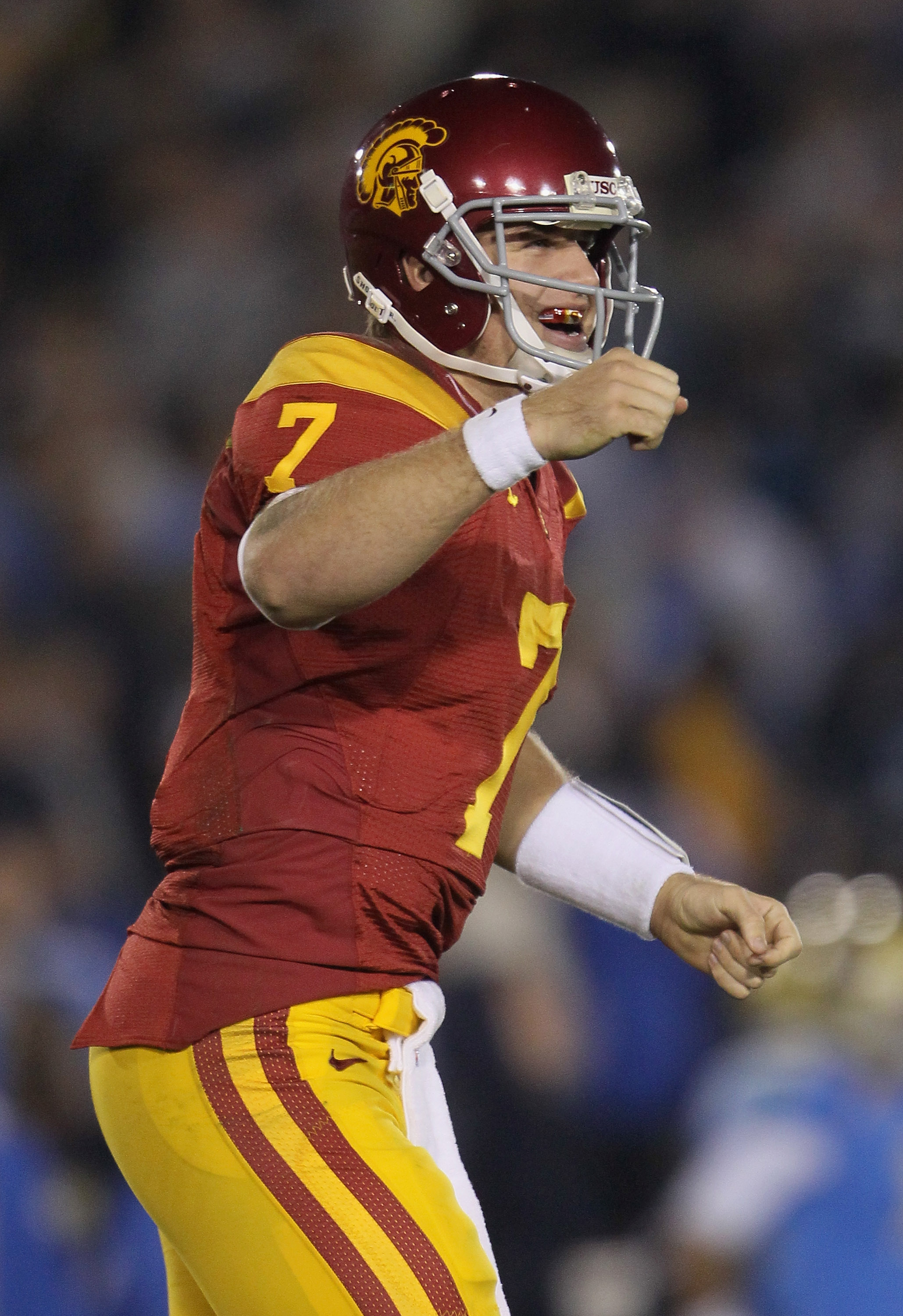 PASADENA, CA - DECEMBER 04:  Quarterback Matt Barkley #7 of the USC Trojans celebrates following a touchdown by running back Allen Bradford (not pictured) late in the second half against the UCLA Bruins at the Rose Bowl on December 4, 2010 in Pasadena, Ca