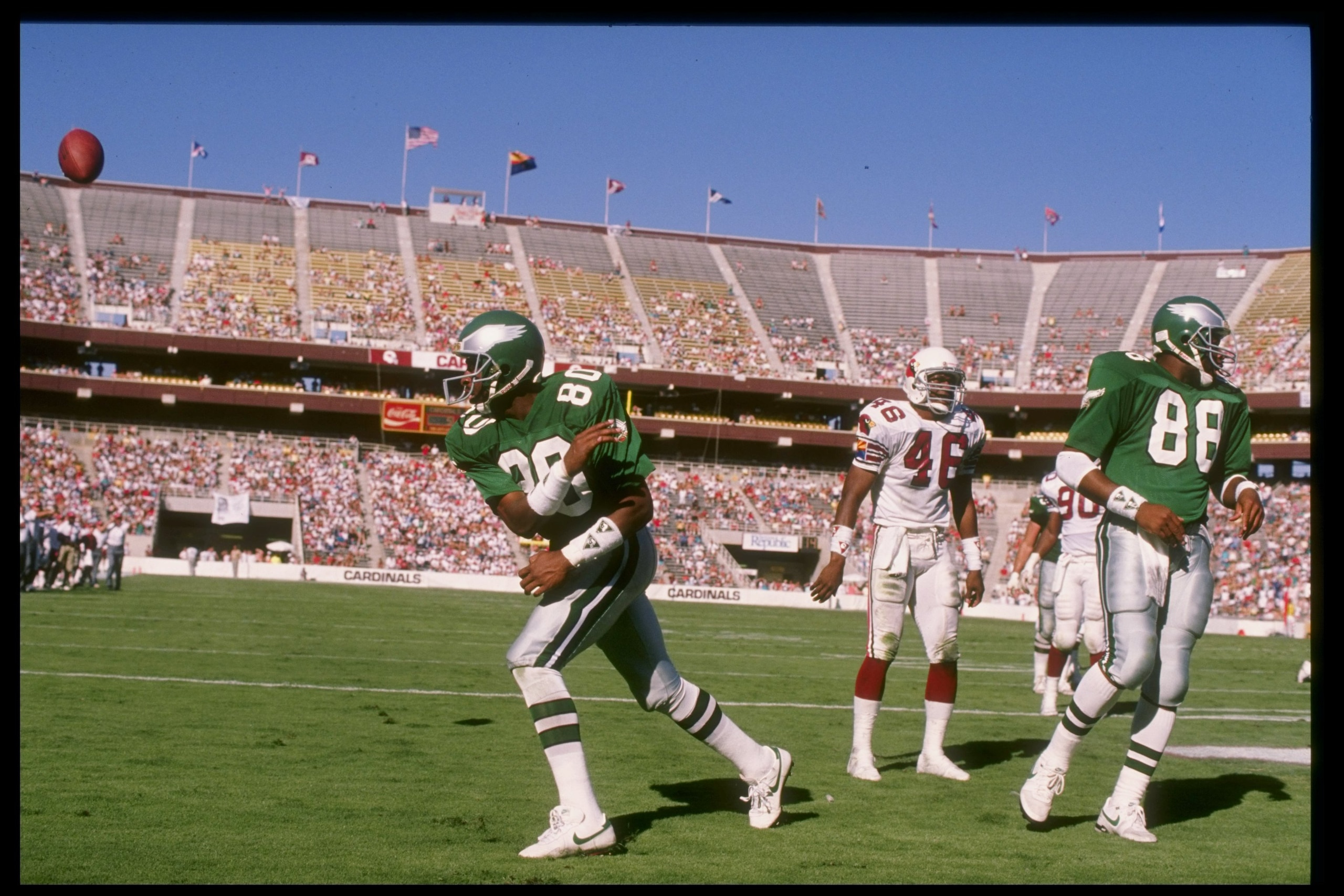 1988:  Wide receiver Cris Carter of the Philadelphia Eagles celebrate a touchdown by spiking the ball in the end zone during a game against the Phoenix Cardinals at Sun Devil Stadium in Tempe, Arizona. Mandatory Credit: Mike Powell  /Allsport