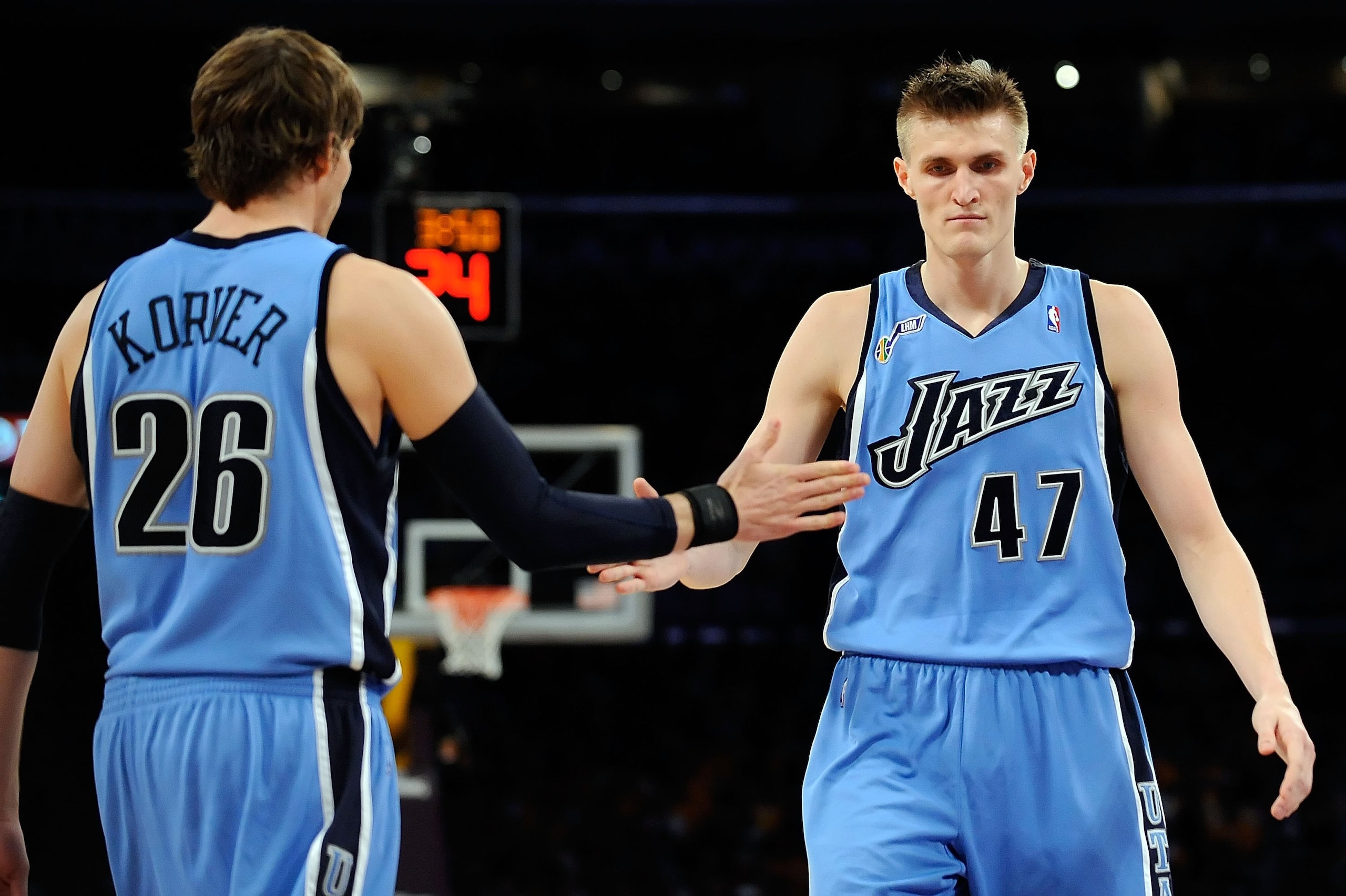 LOS ANGELES, CA - APRIL 19:  (R-L) Andrei Kirilenko #47 of the Utah Jazz gives teammate Kyle Kover #26 a five against the Los Angeles Lakers in Game One of the Western Conference Quarterfinals during the 2009 NBA Playoffs at Staples Center on April 19, 20