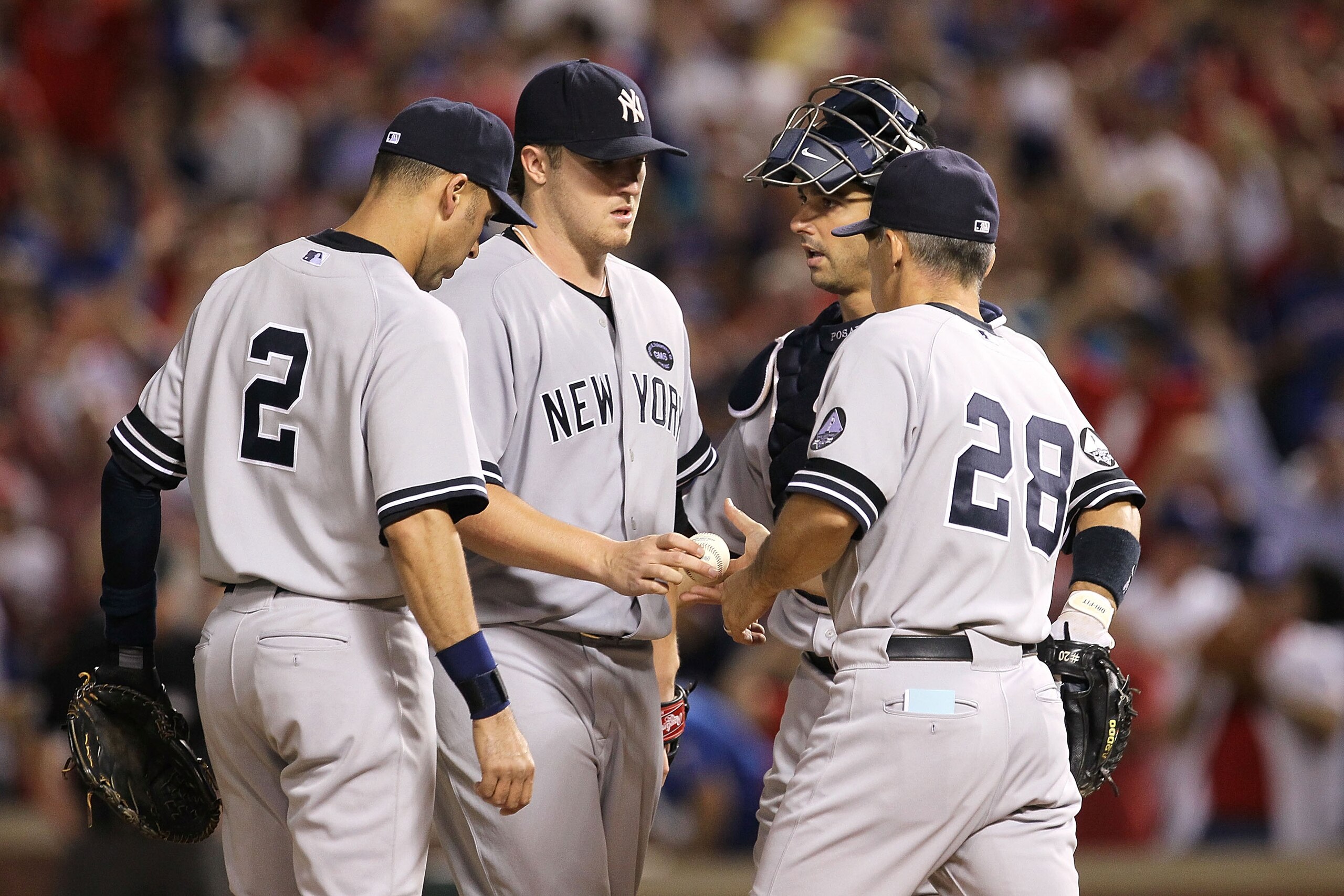 ARLINGTON, TX - OCTOBER 22:  Manager Joe Girardi of the New York Yankees pulls Phil Hughes #65 in Game Six of the ALCS against the Texas Rangers during the 2010 MLB Playoffs at Rangers Ballpark in Arlington on October 22, 2010 in Arlington, Texas.  (Photo
