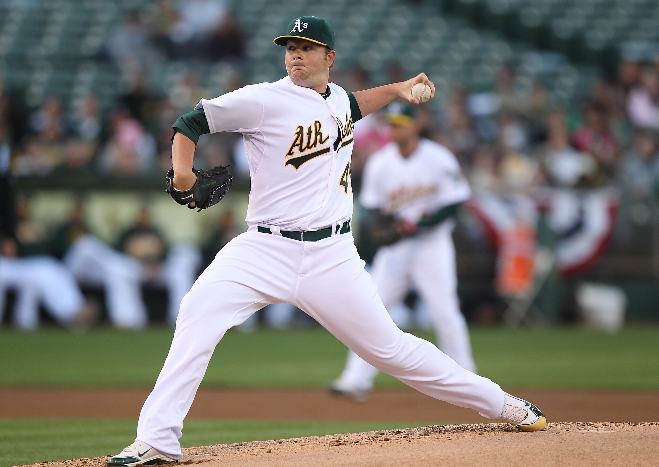 OAKLAND, CA - APRIL 2:  Brett Anderson #49 of the Oakland Athletics pitches against the Seattle Mariners during a Major League Baseball game at the Oakland-Alameda County Coliseum on April 2, 2011 in Oakland, California. (Photo by Jed Jacobsohn/Getty Imag