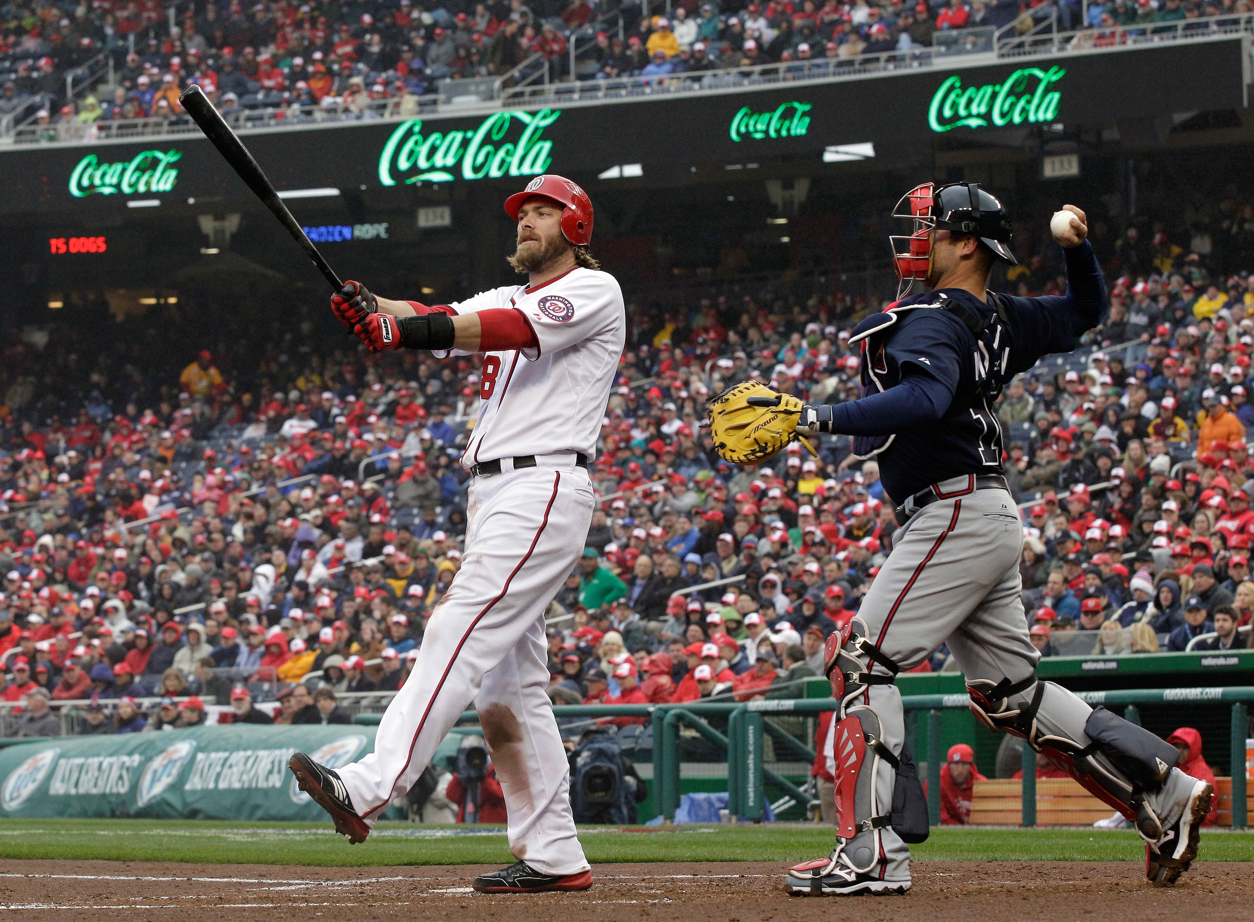 WASHINGTON, DC - MARCH 31: Catccher Brian McCann #16 of the Atlanta Braves throws the ball back to the pitcher after Jayson Werth #28 of the Washington Nationals strikes out during the third inning at Nationals Park on March 31, 2011 in Washington, DC.  (