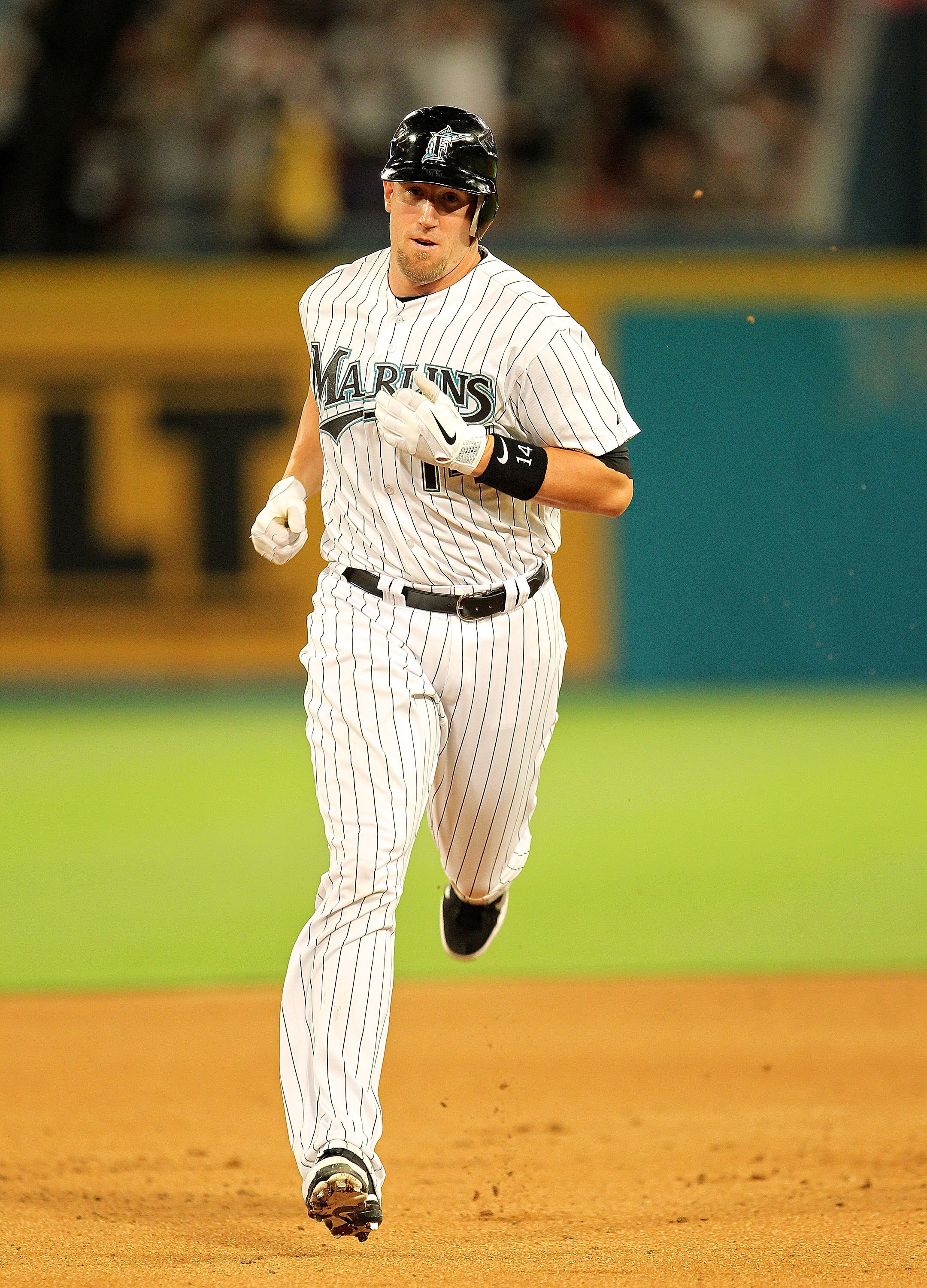 MIAMI GARDENS, FL - APRIL 01: John Buck #14 of the Florida Marlins rounds second after hitting a grand slam during opening day against the New York Mets at Sun Life Stadium on April 1, 2011 in Miami Gardens, Florida.  (Photo by Mike Ehrmann/Getty Images)