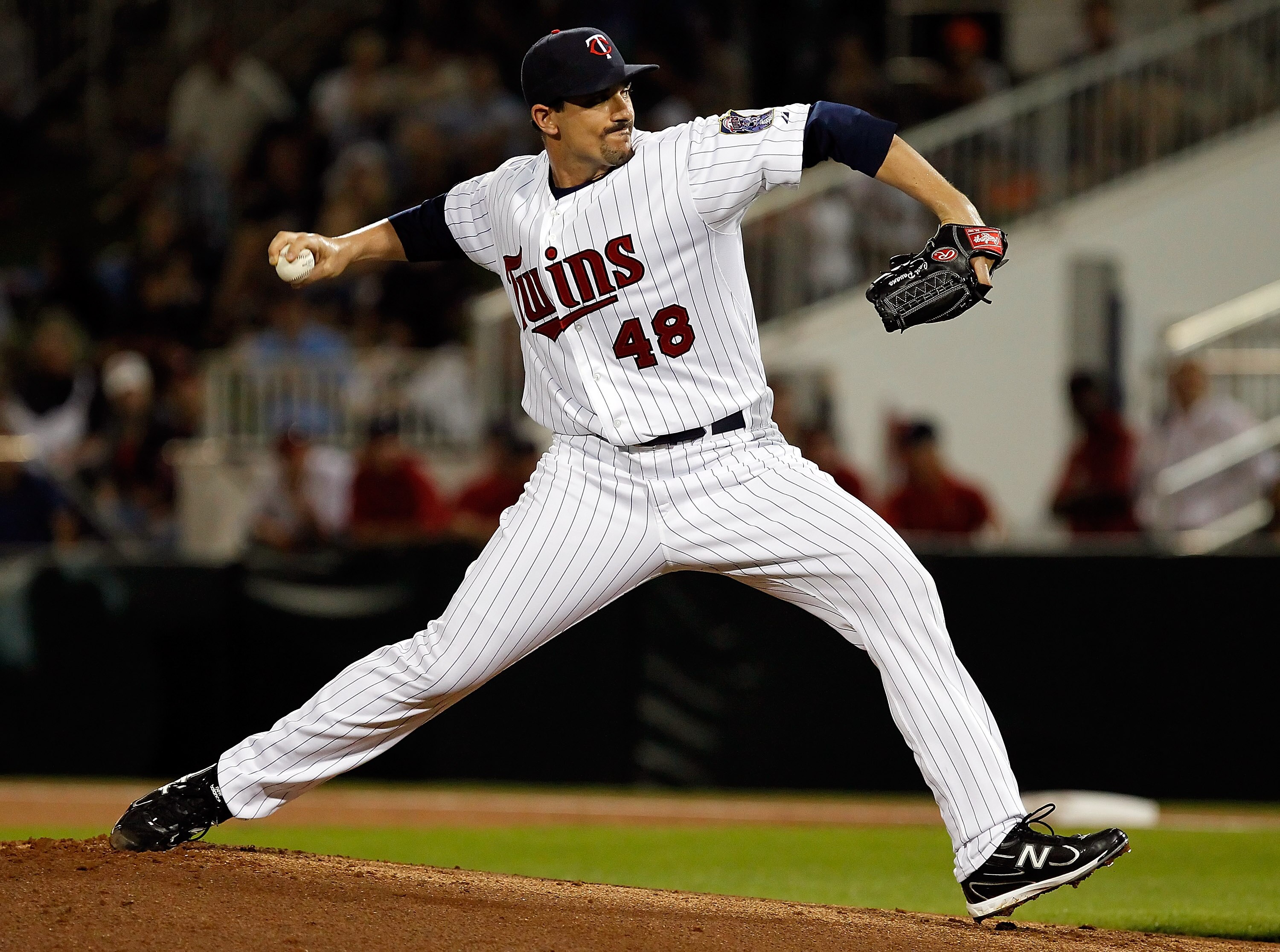 FORT MYERS, FL - FEBRUARY 27:  Pitcher Carl Pavano #48 of the Minnesota Twins pitches against the Boston Red Sox during a Grapefruit League Spring Training Game at Hammond Stadium on February 27, 2011 in Fort Myers, Florida.  (Photo by J. Meric/Getty Imag