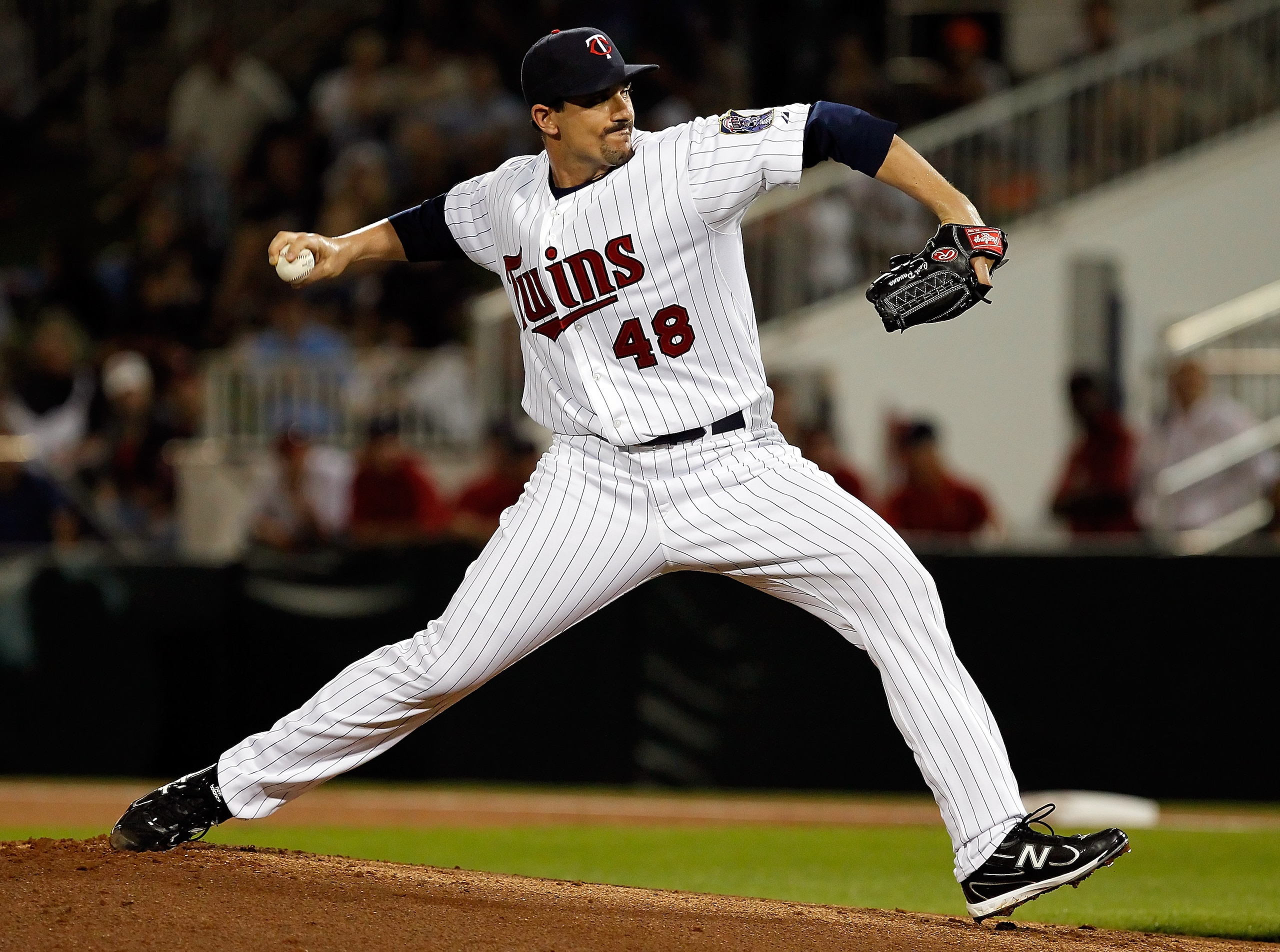FORT MYERS, FL - FEBRUARY 27:  Pitcher Carl Pavano #48 of the Minnesota Twins pitches against the Boston Red Sox during a Grapefruit League Spring Training Game at Hammond Stadium on February 27, 2011 in Fort Myers, Florida.  (Photo by J. Meric/Getty Imag