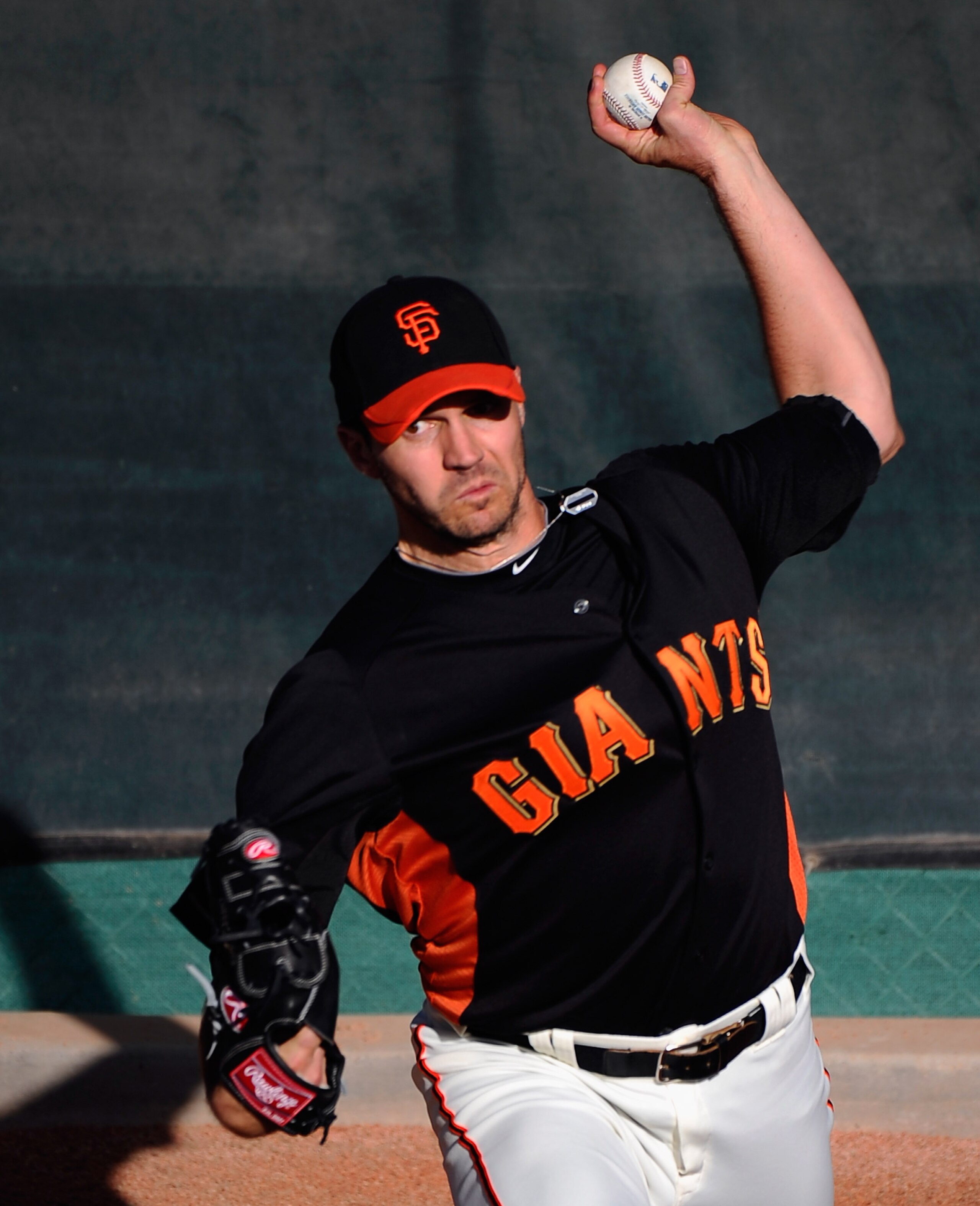 SCOTTSDALE, AZ - MARCH 07:  Pitcher Barry Zito #75 of the San Francisco Giants thorws a pitch in the bullpen prior to the start of the spring training baseball game against the Texas Rangers in the first meeting between the two teams since the World Serie