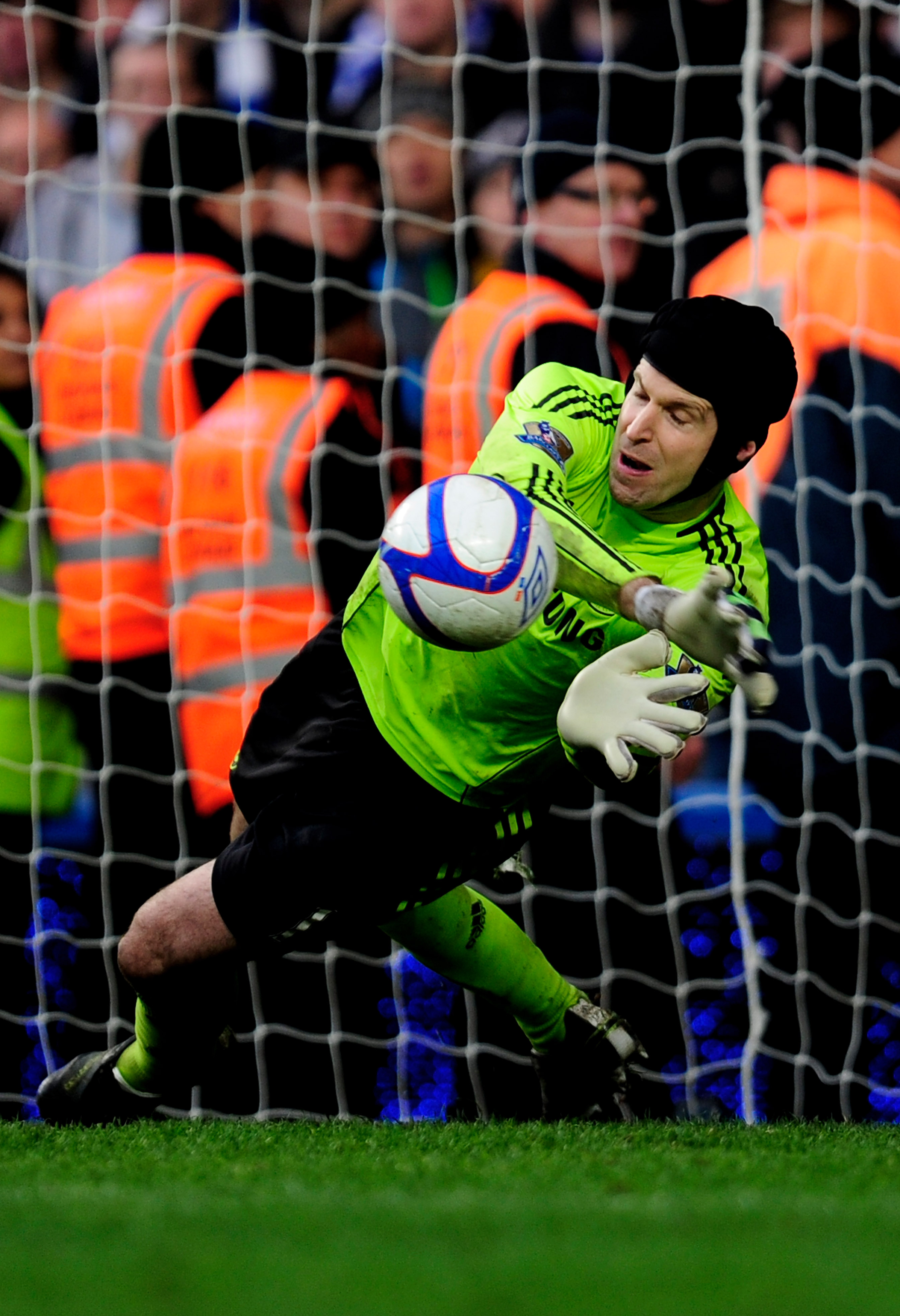 LONDON, ENGLAND - FEBRUARY 19:  Petr Cech of Chelsea saves the penalty of Leighton Baines of Everton in the penalty shootout during the FA Cup sponsored by E.ON 4th round replay match between Chelsea and Everton at Stamford Bridge on February 19, 2011 in