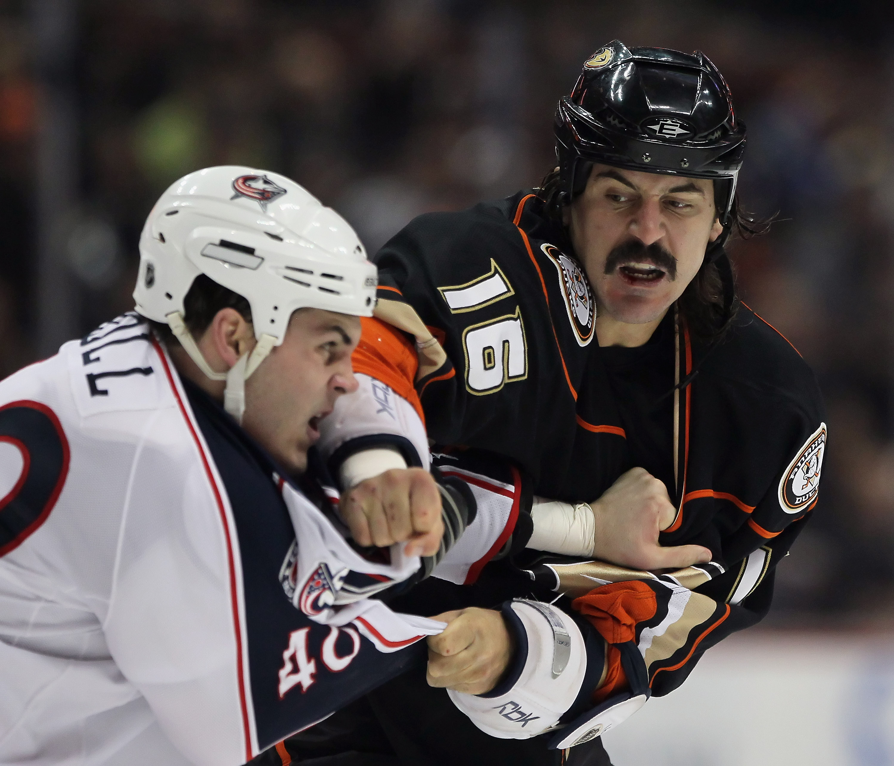 ANAHEIM, CA - JANUARY 07:  George Parros #16 of the Anaheim Ducks throws a punch at Jared Boll #40 of the Columbus Blue Jackets in the first period at the Honda Center on January 7, 2011 in Anaheim, California.  (Photo by Jeff Gross/Getty Images)