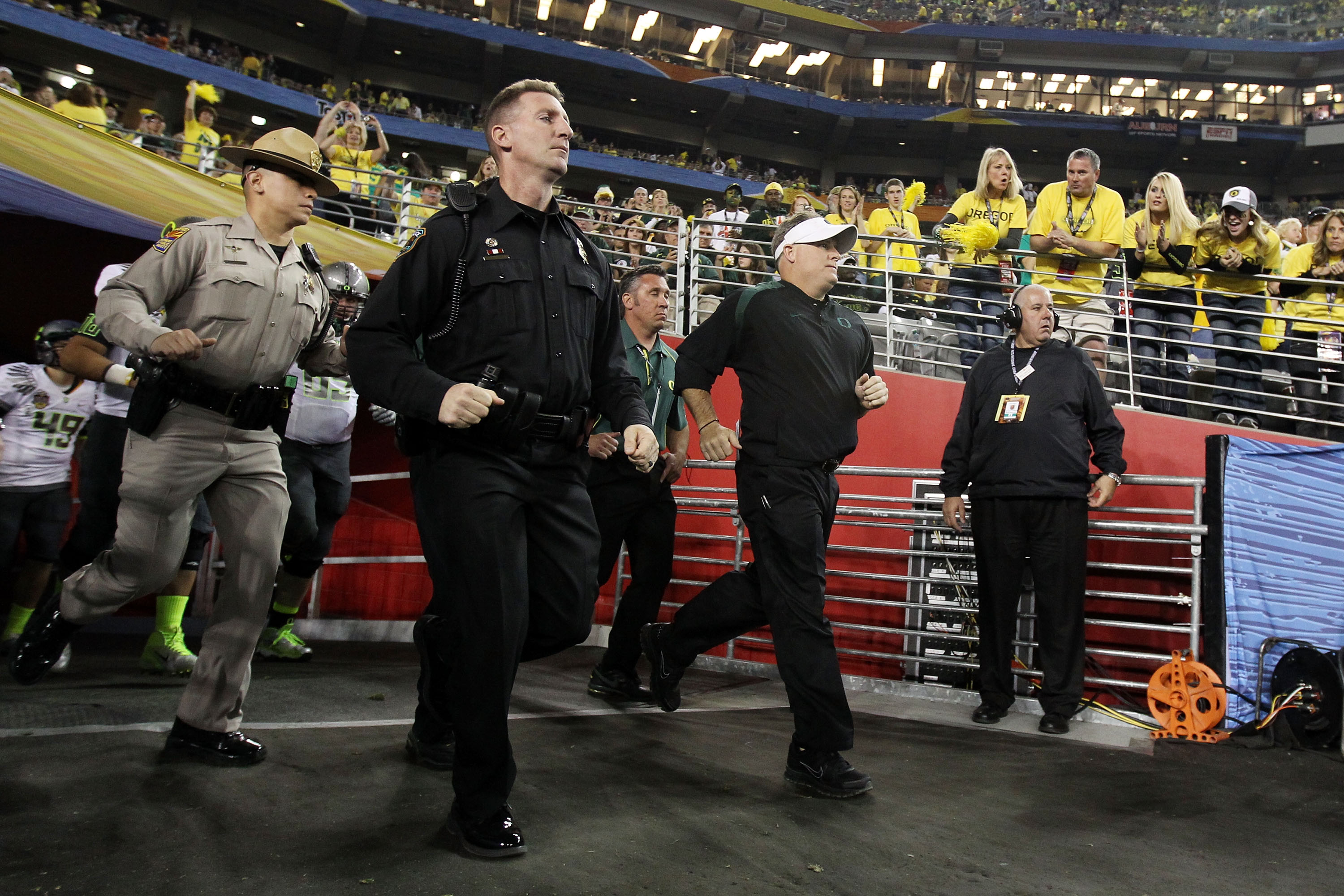GLENDALE, AZ - JANUARY 10:  Head coach Chip Kelly of the Oregon Ducks takes the field during their 22-19 loss to the Auburn Tigers during the Tostitos BCS National Championship Game at University of Phoenix Stadium on January 10, 2011 in Glendale, Arizona