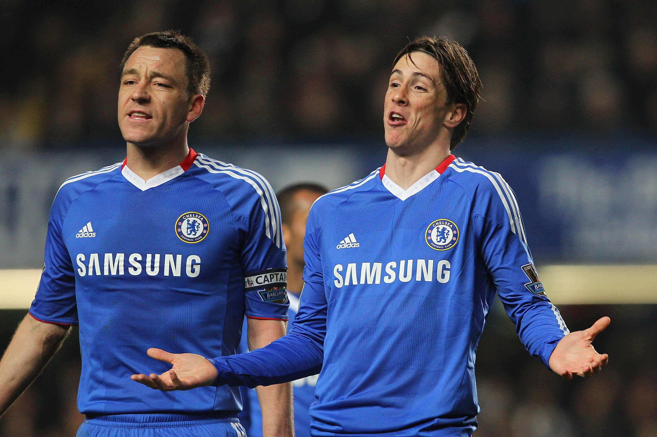 LONDON, ENGLAND - MARCH 01:  Fernando Torres and John Terry (L) of Chelsea make their point during the Barclays Premier League match between Chelsea and Manchester United at Stamford Bridge on March 1, 2011 in London, England.  (Photo by Clive Rose/Getty
