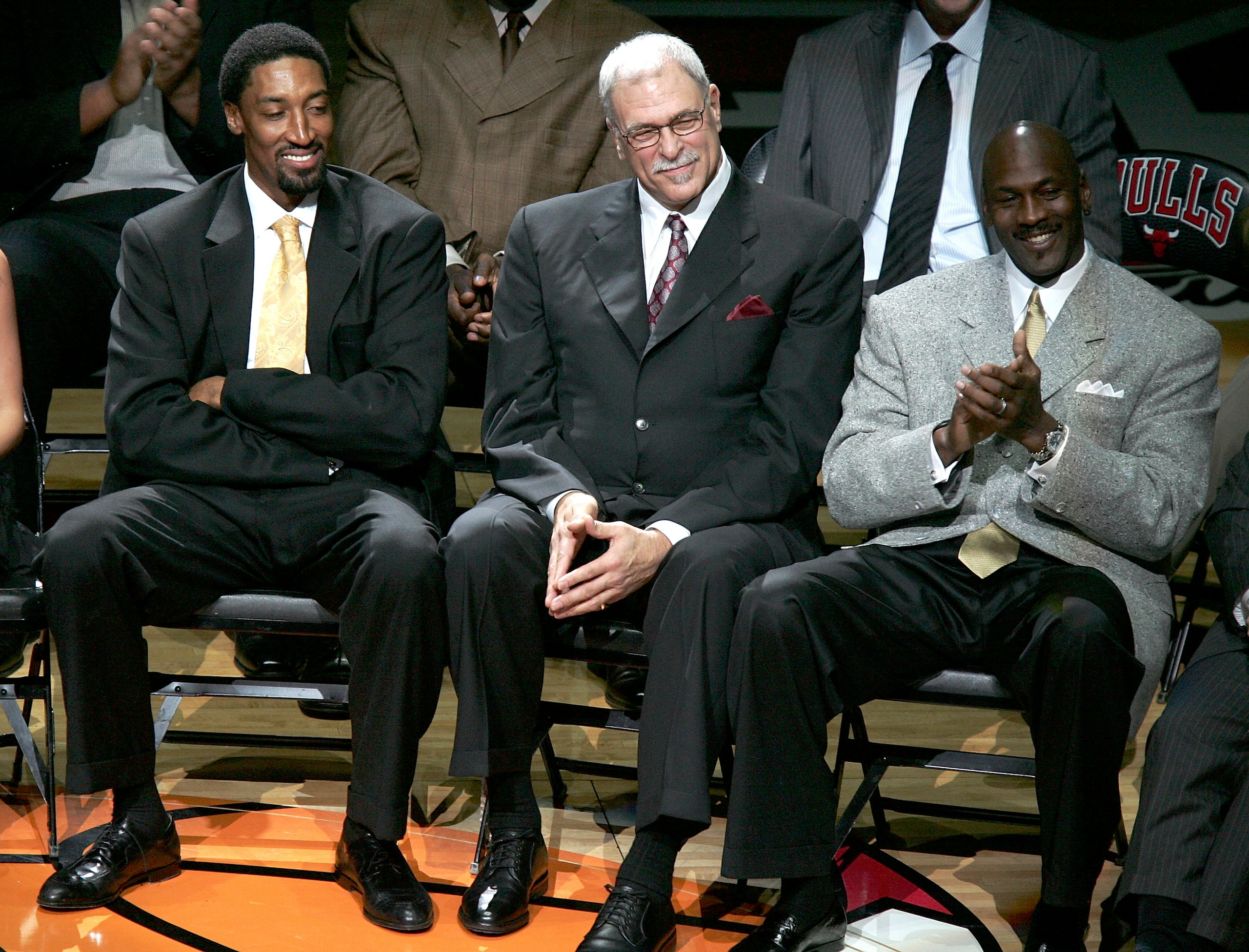 CHICAGO - DECEMBER 9:  (L-R) Scottie Pippen, Phil Jackson and Michael Jordan, formerly of the Chicago Bulls, look on during a ceremony retiring Pippen's #33 at halftime of a game between the Bulls and the Los Angeles Lakers on December 9, 2005 at the Unit