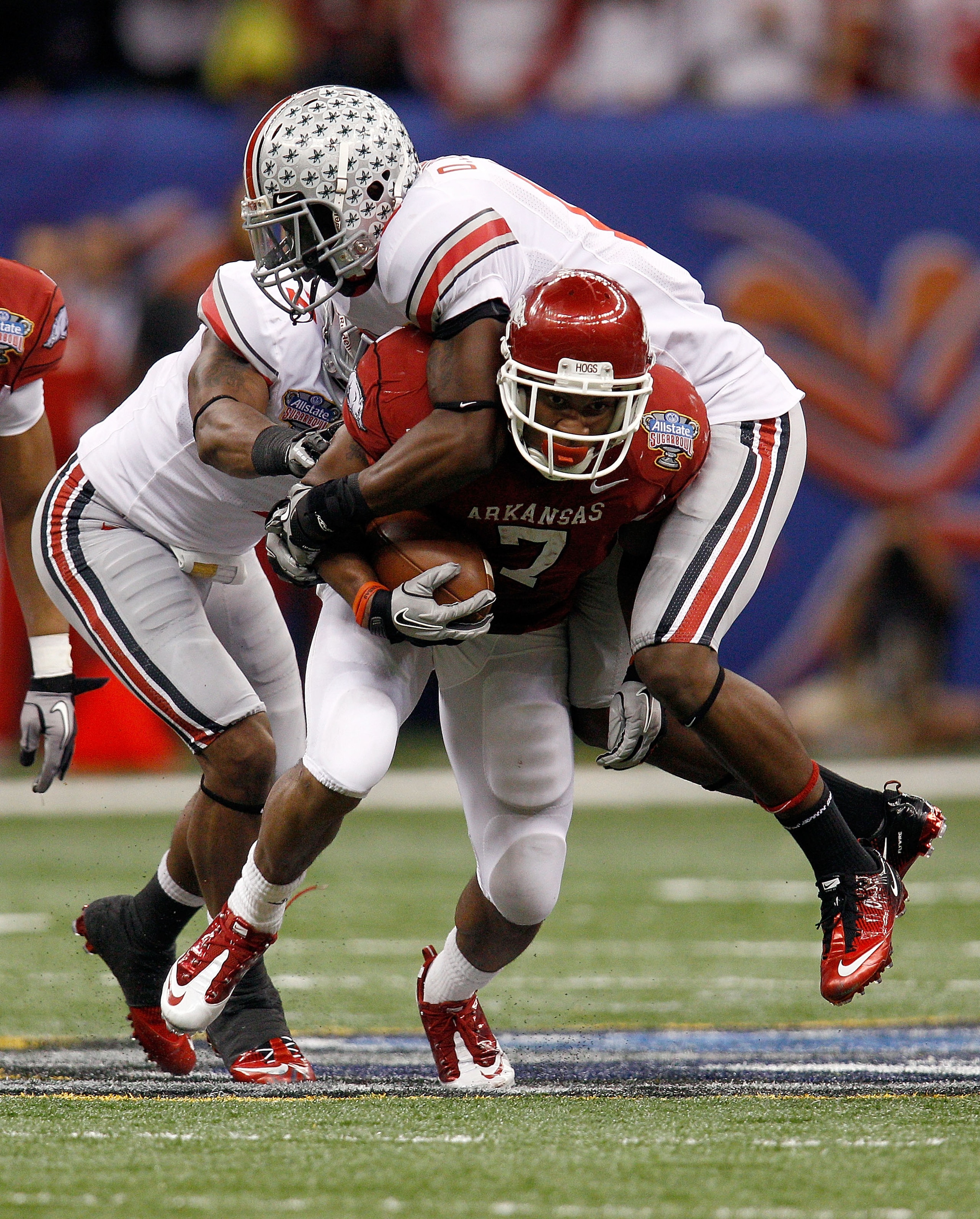 NEW ORLEANS, LA - JANUARY 04: Knile Davis #7 of the Arkansas Razorbacks runs the ball as Orhian Johnson #19 of the Ohio State Buckeyes attempts to tackle him in the second quarter during the Allstate Sugar Bowl at the Louisiana Superdome on January 4, 20 NEW ORLEANS, LA - JANUARY 04: Knile Davis #7 of the Arkansas Razorbacks runs the ball as Orhian Johnson #19 of the Ohio State Buckeyes attempts to tackle him in the second quarter during the Allstate Sugar Bowl at the Louisiana Superdome on January 4, 20