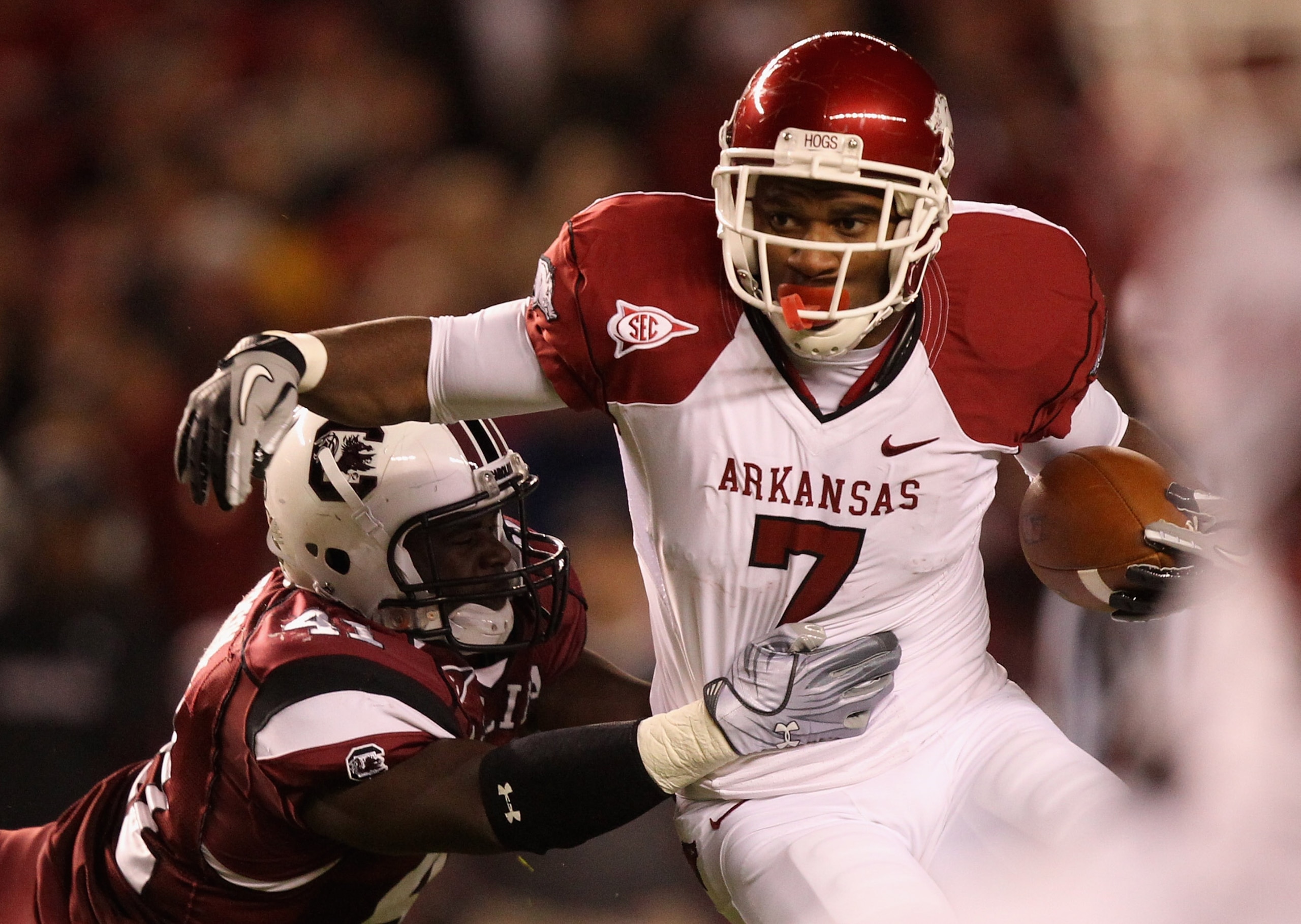 COLUMBIA, SC - NOVEMBER 06: Knile Davis #7 of the Arkansas Razorbacks pushes away from Josh Dickerson #41 of the South Carolina Gamecocks during their game at Williams-Brice Stadium on November 6, 2010 in Columbia, South Carolina. (Photo by Streeter Lec COLUMBIA, SC - NOVEMBER 06: Knile Davis #7 of the Arkansas Razorbacks pushes away from Josh Dickerson #41 of the South Carolina Gamecocks during their game at Williams-Brice Stadium on November 6, 2010 in Columbia, South Carolina. (Photo by Streeter Lec