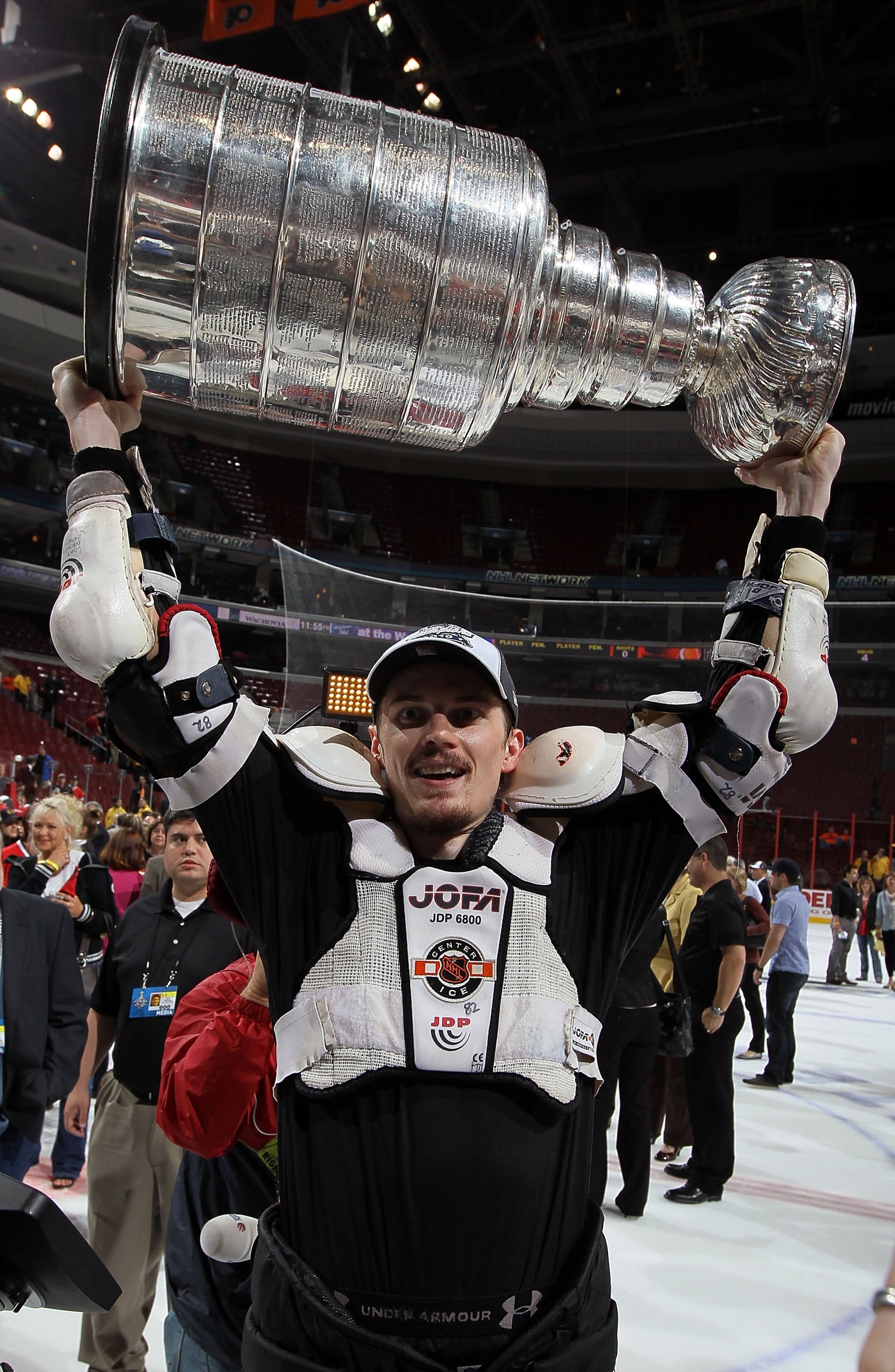 PHILADELPHIA - JUNE 09:  Tomas Kopecky #82 of the Chicago Blackhawks hoists the Stanley Cup after teammate Patrick Kane scored the game-winning goal in overtime to defeat the Philadelphia Flyers 4-3 and win the Stanley Cup in Game Six of the 2010 NHL Stan