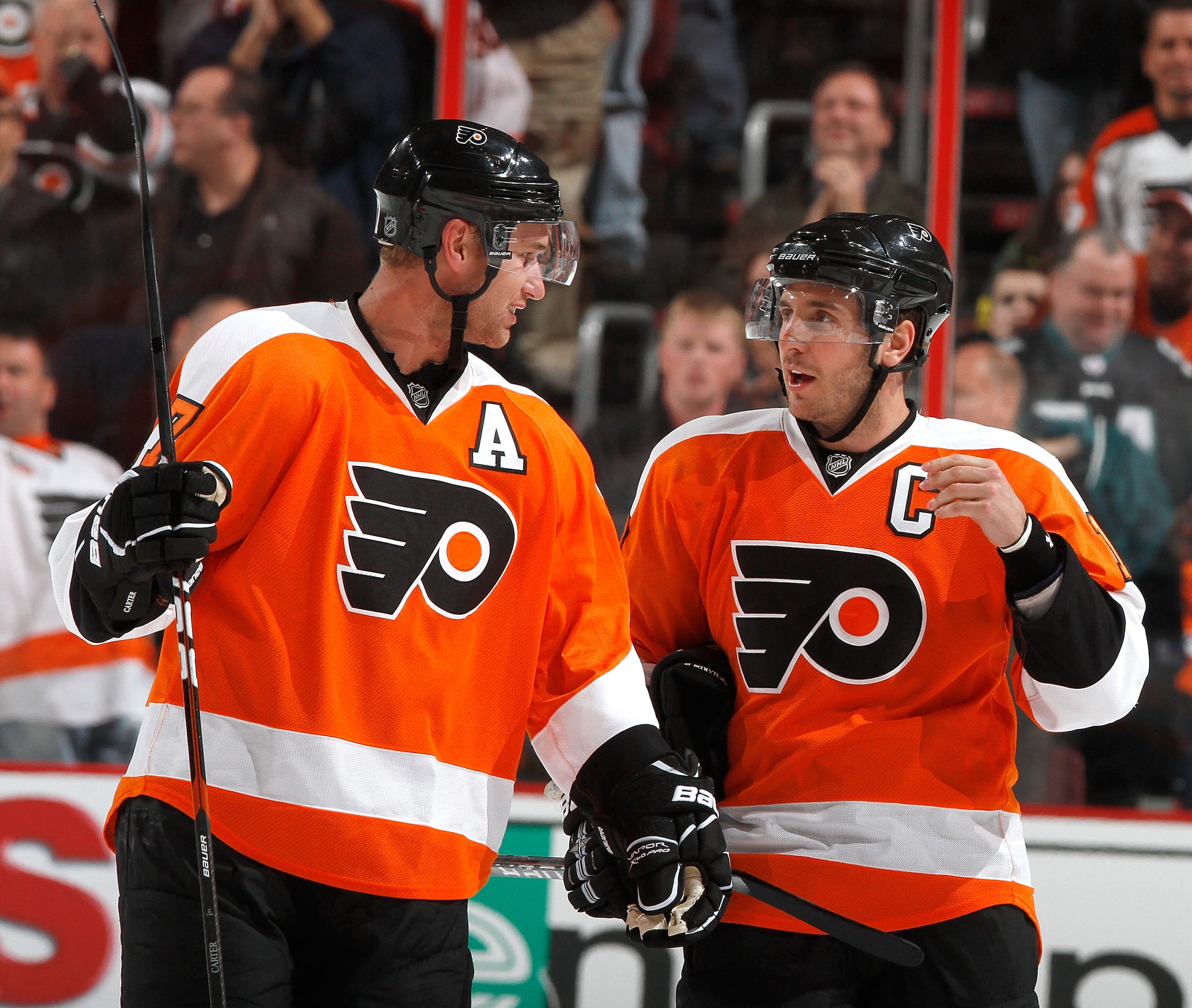 PHILADELPHIA, PA - FEBRUARY 03:  Jeff Carter #17 and Mike Richards #18 of the Philadelphia Flyers talk during a break in action in an NHL hockey game against the Nashville Predators at the Wells Fargo Center on February 3, 2011 in Philadelphia, Pennsylvan