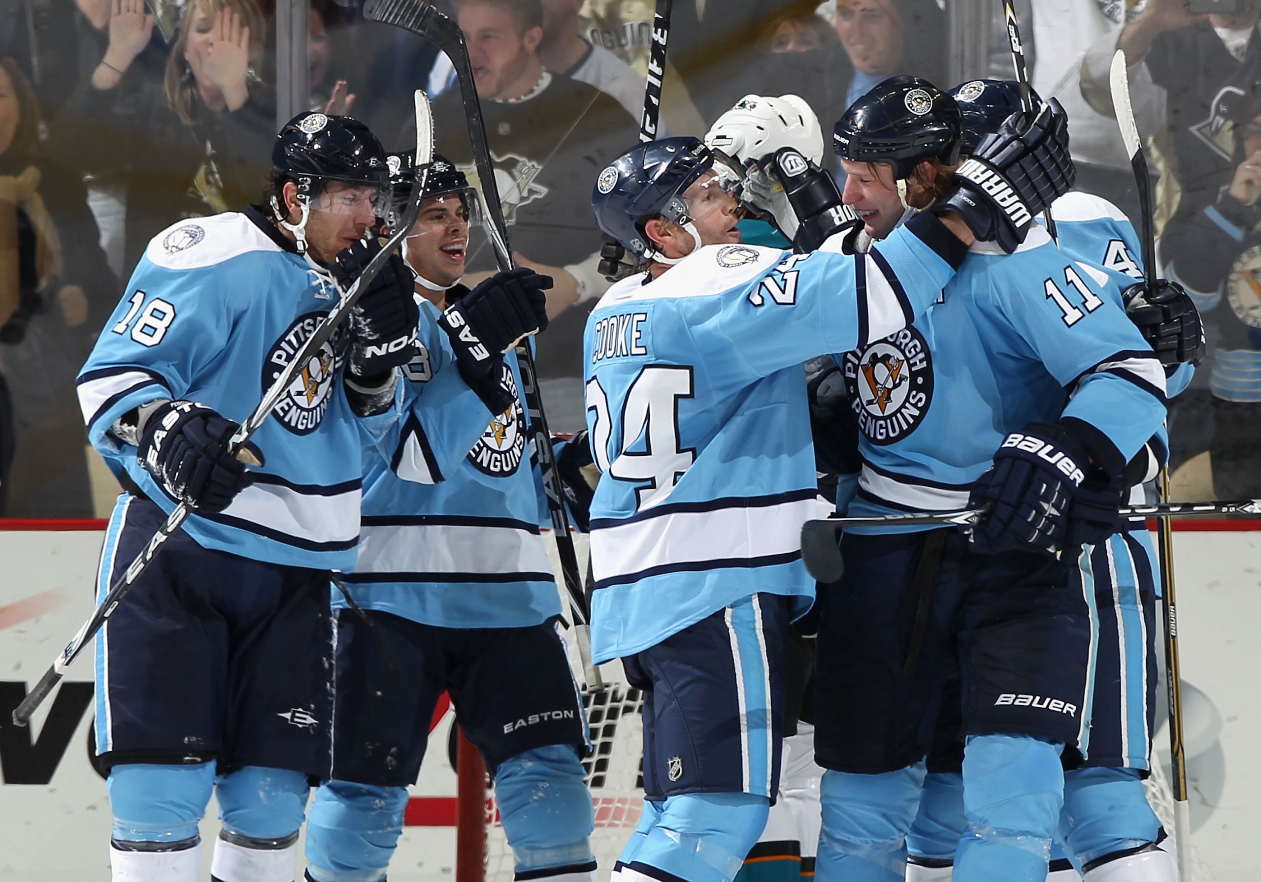 PITTSBURGH, PA - FEBRUARY 23:  (L-R) James Neal #18, Tyler Kennedy #48, Matt Cooke #24 and Jordan Staal #11 of the Pittsburgh Penguins celebrate after Kennedy scored a late third period goal against the San Jose Sharks during the NHL game at Consol Energy