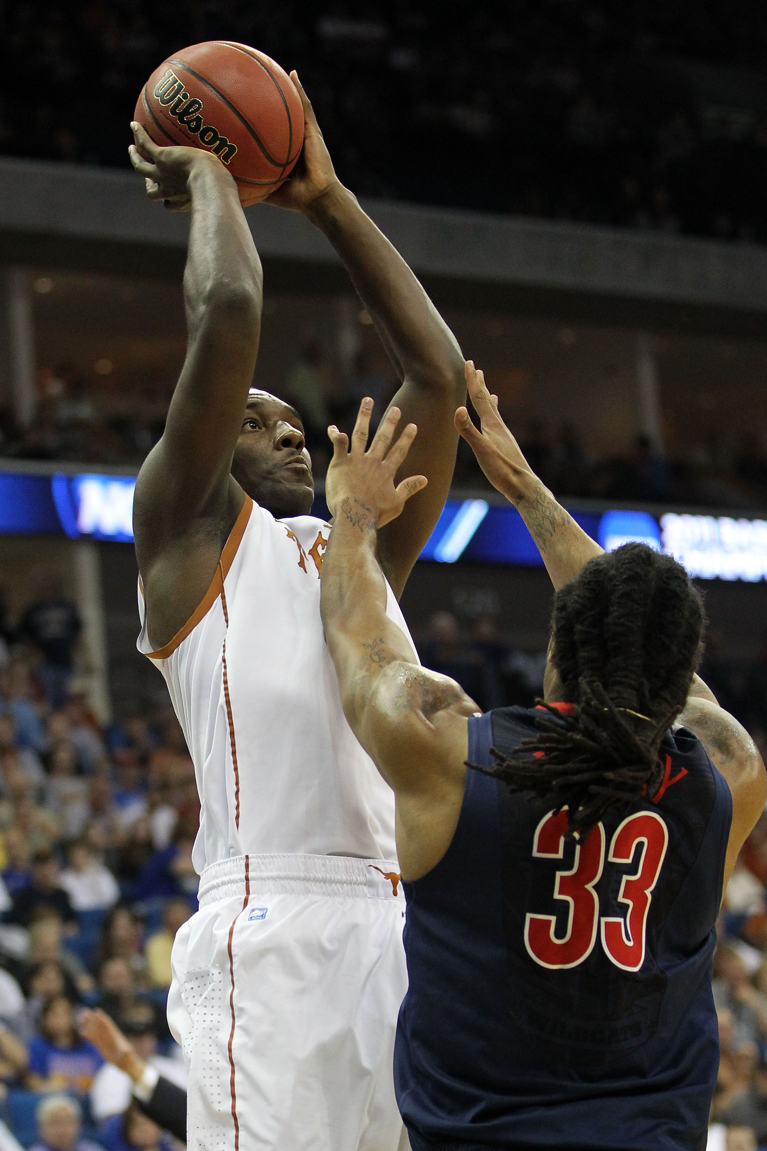 TULSA, OK - MARCH 20:  Jordan Hamilton #3 of the Texas Longhorns goes up for a shot against Jesse Perry #33 of the Arizona Wildcats during the third round of the 2011 NCAA men's basketball tournament at BOK Center on March 20, 2011 in Tulsa, Oklahoma.  (P