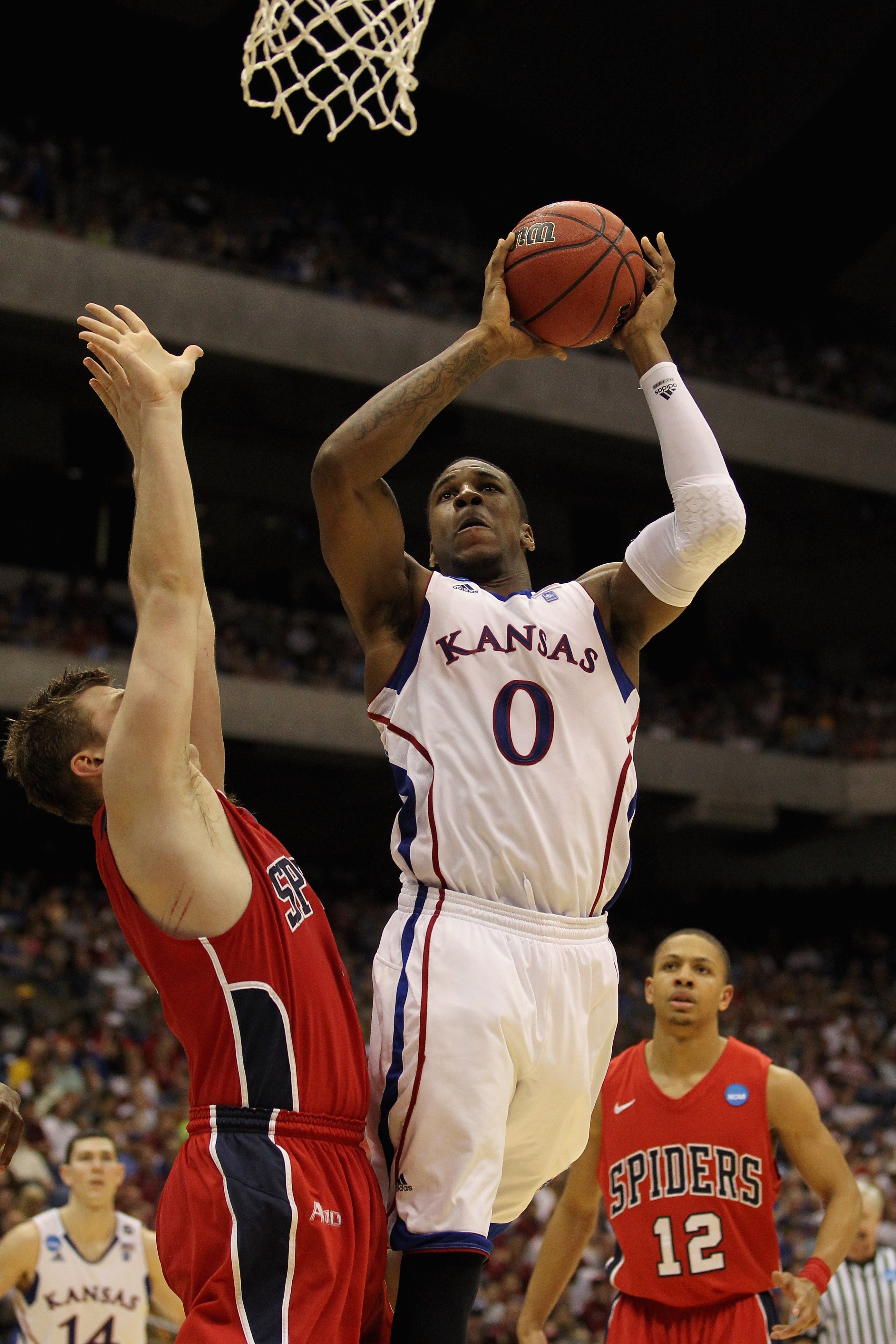 SAN ANTONIO, TX - MARCH 25:  Thomas Robinson #0 of the Kansas Jayhawks goes to the basket against the Richmond Spiders during the southwest regional of the 2011 NCAA men's basketball tournament at the Alamodome on March 25, 2011 in San Antonio, Texas.  (P