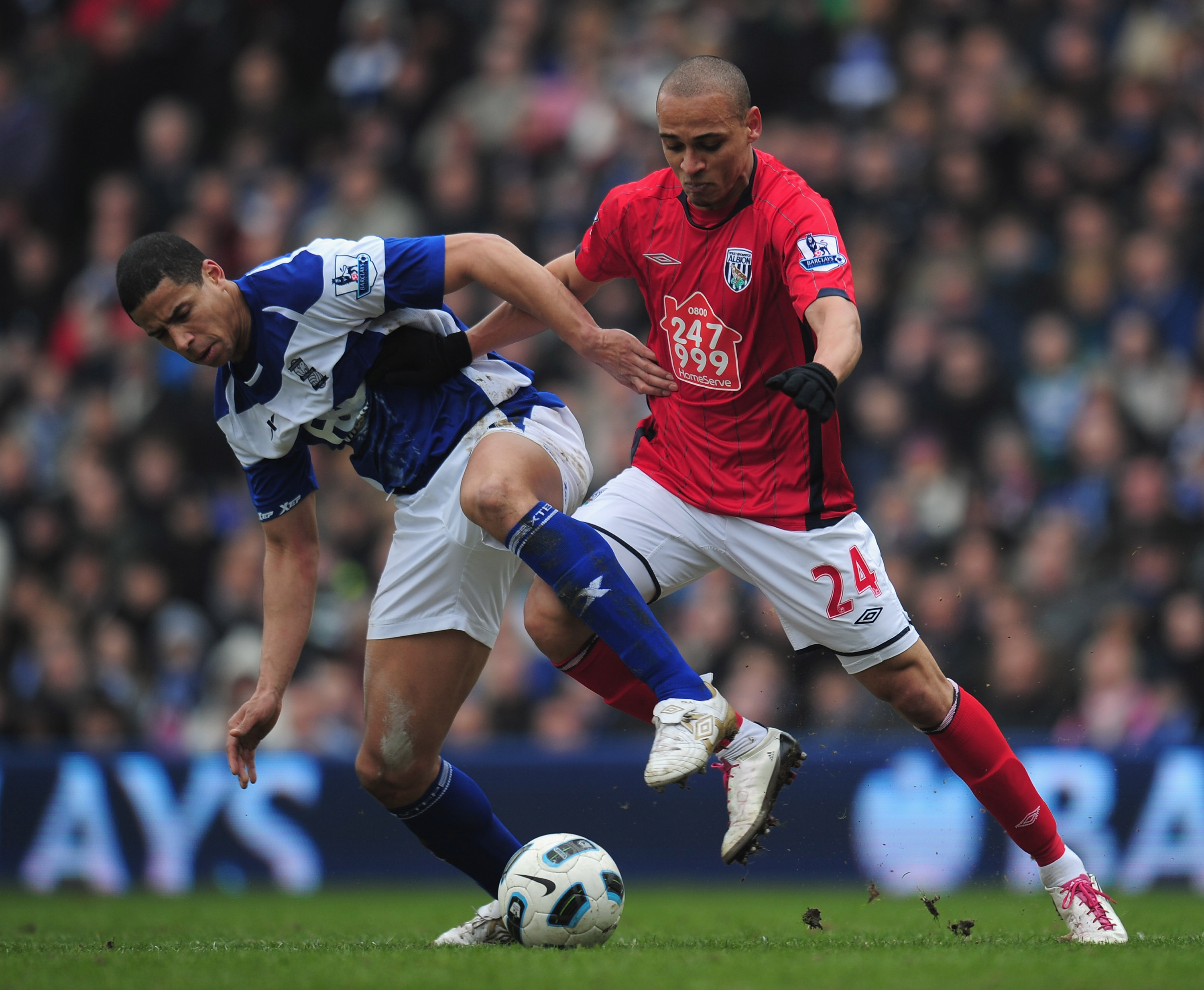 BIRMINGHAM, ENGLAND - MARCH 05:  Peter Odemwingie of West Bromich Albion is challenged by Curtis Davies of Birmingham City during the Barclays Premier League match between Birmingham City and West Bromwich Albion  on March 5, 2011 in Birmingham, England.