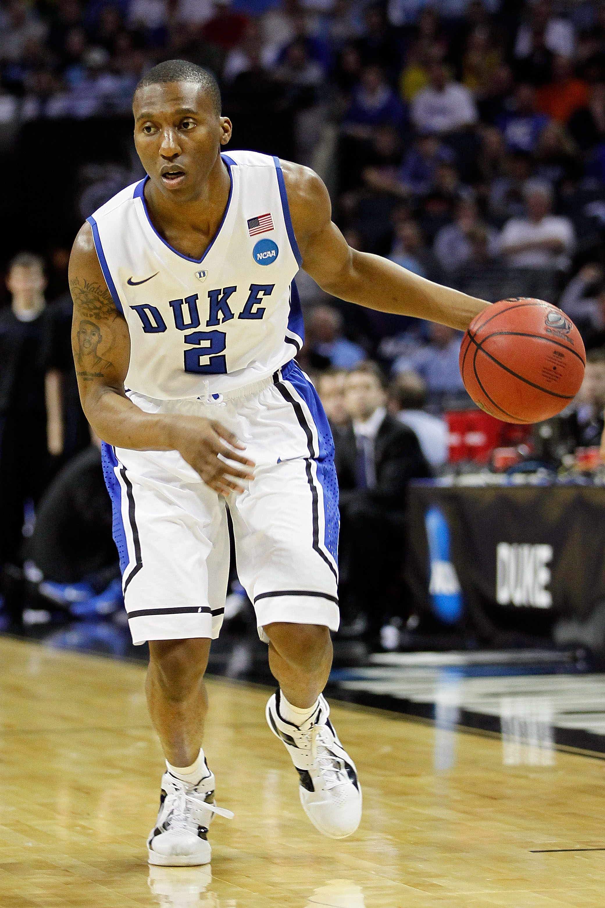 CHARLOTTE, NC - MARCH 20:  Nolan Smith #2 of the Duke Blue Devils moves the ball while taking on the Michigan Wolverines during the third round of the 2011 NCAA men's basketball tournament at Time Warner Cable Arena on March 20, 2011 in Charlotte, North C