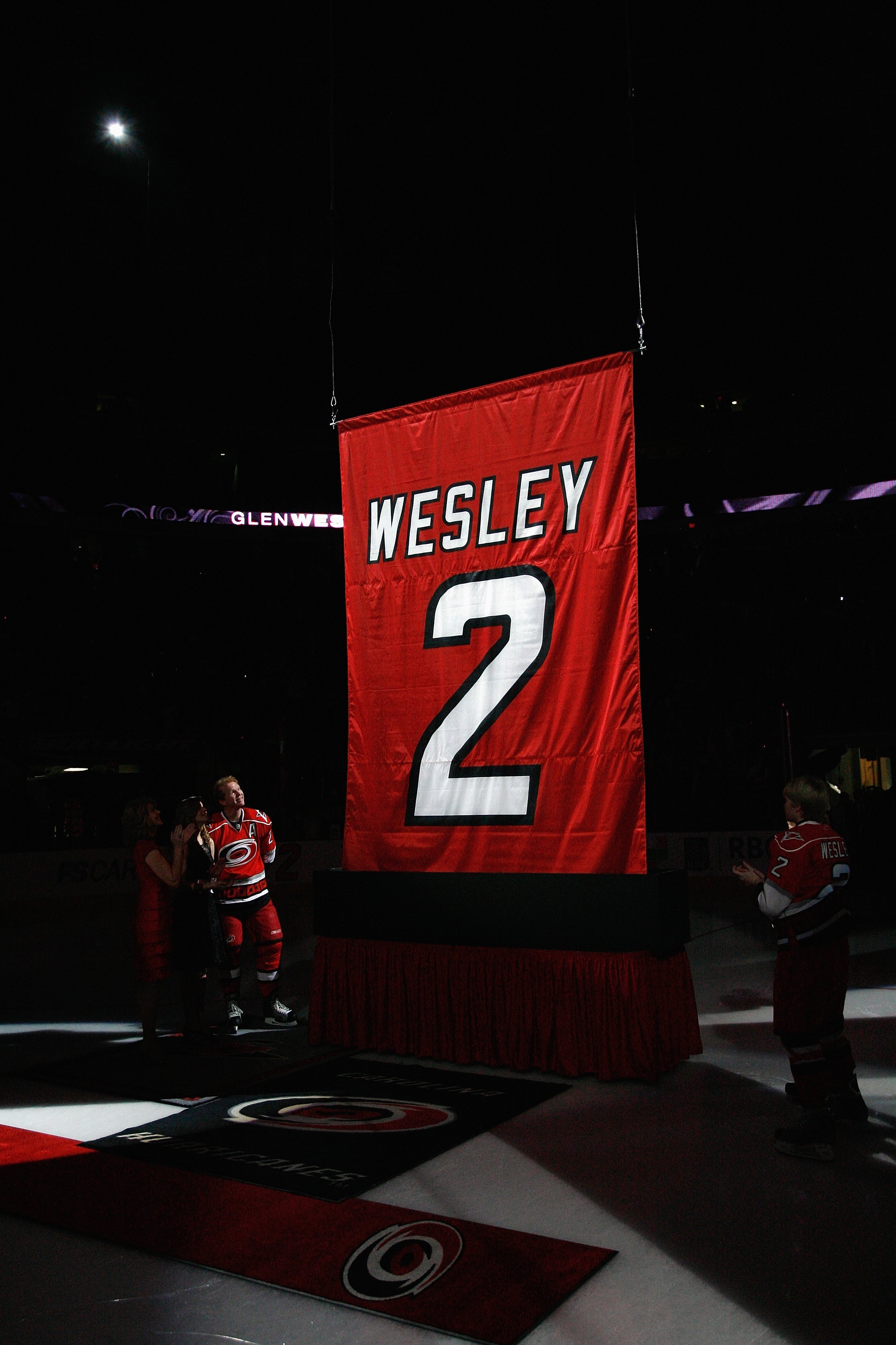 RALEIGH, NC - FEBRUARY 17: Glen Wesley #2 of the Carolina Hurricanes watches as his jersey is raised to the rafters during a ceremony before the game against the Boston Bruins on February 17, 2009 at RBC Center in Raleigh, North Carolina. (Photo by Kevin