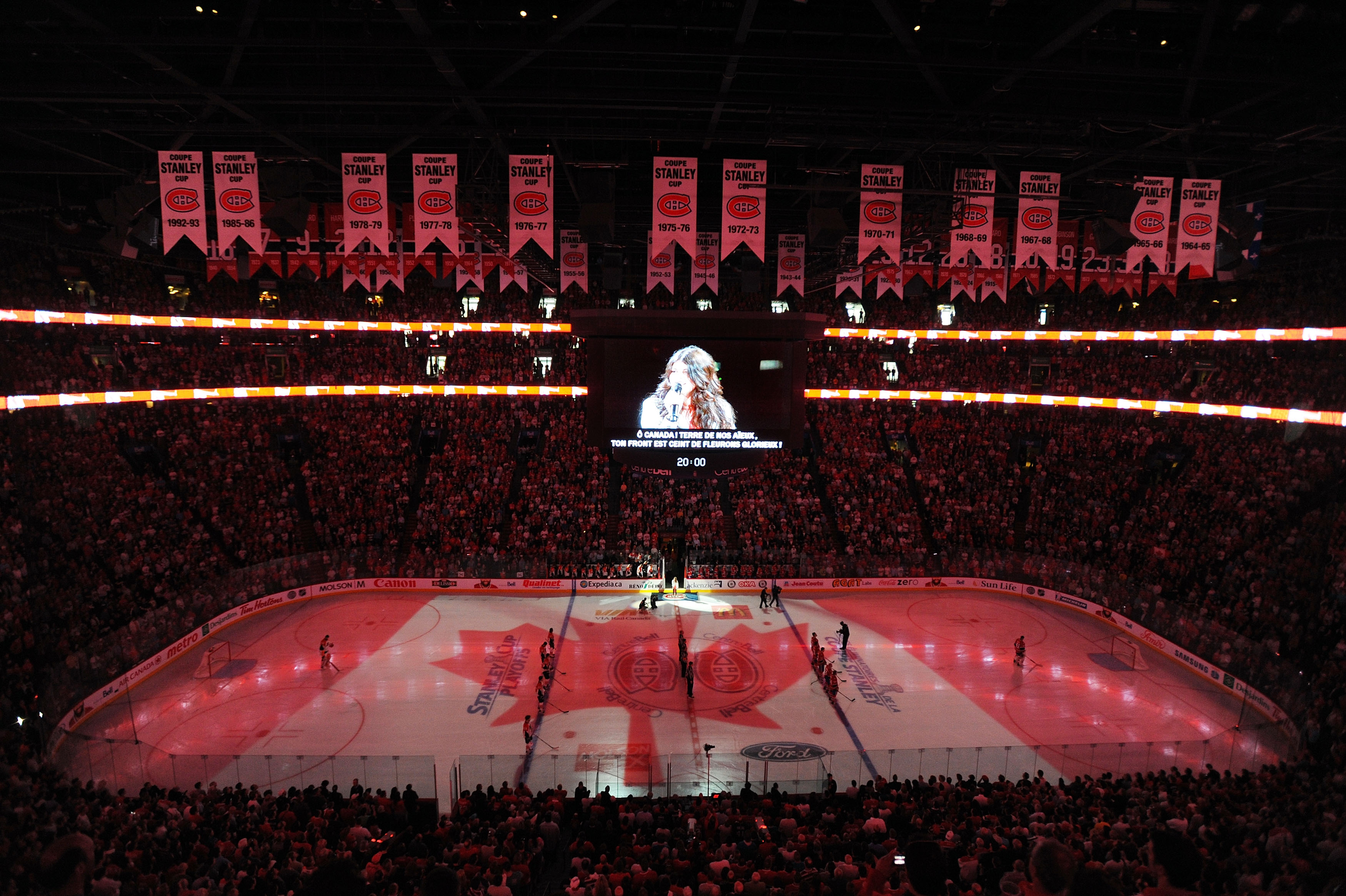 MONTREAL, QC - MAY 22:  Fans and players stand at attention as the Canadian National Anthem is perform prior to the start of Game 4 of the Eastern Conference Finals during the 2010 NHL Stanley Cup Playoffs at Bell Centre on May 22, 2010 in Montreal, Canad