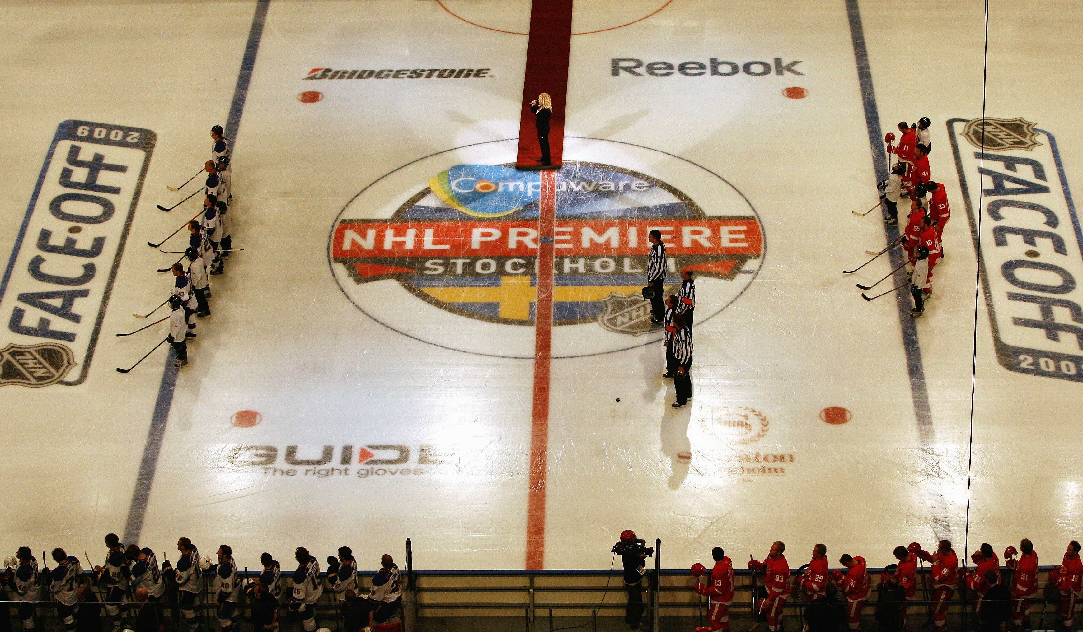 STOCKHOLM, SWEDEN - OCTOBER 02:  Players from Detroit Red Wings and St. Louis Blues line up for the national anthems of United States and Sweden before the start of the 2009 Compuware NHL Premiere Stockholm match between Detroit Red Wings and St. Louis Bl