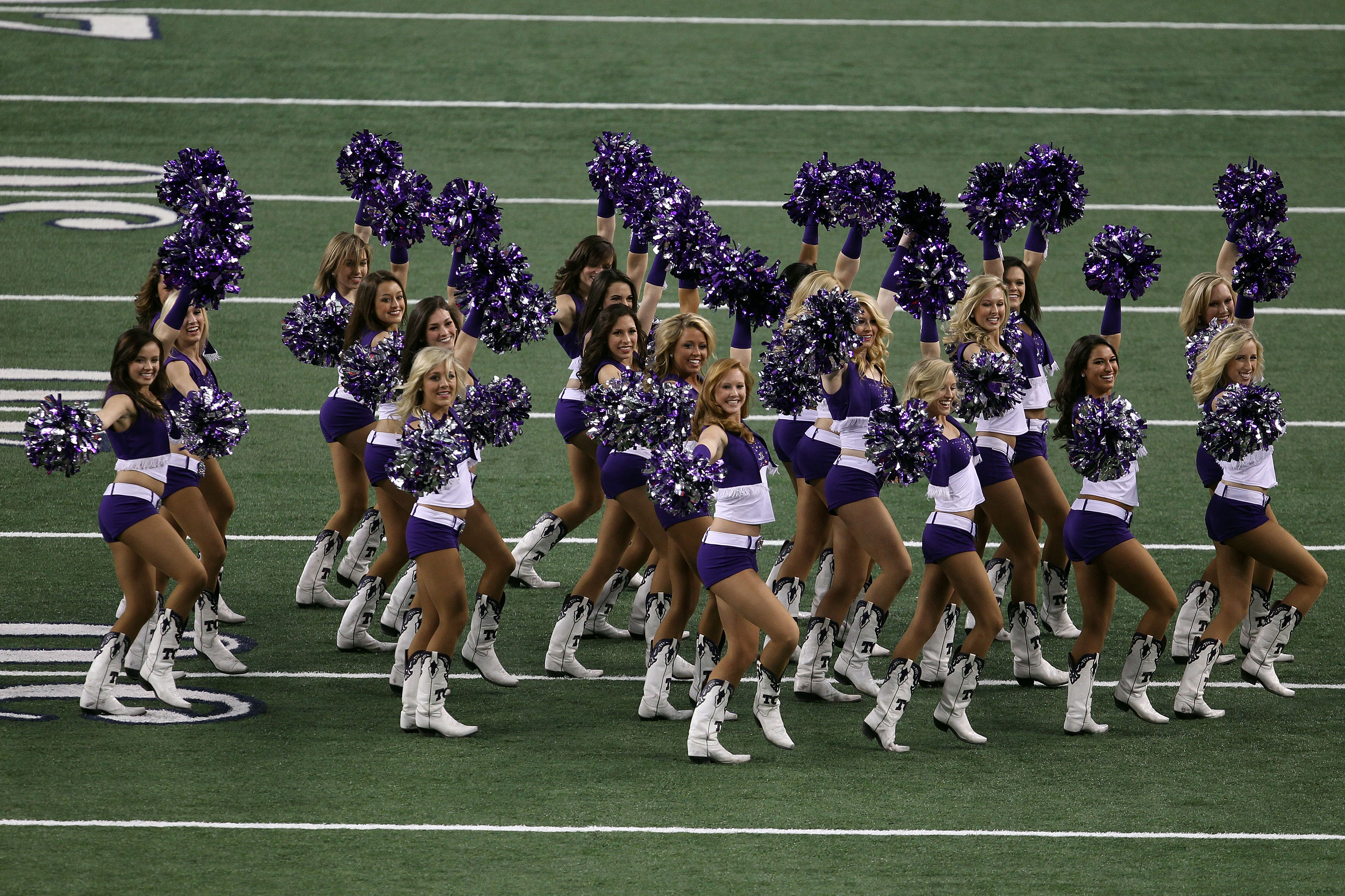 ARLINGTON, TX - FEBRUARY 06:  TCU cheerleaders perform before the Green Bay Packers play against the Pittsburgh Steelers in Super Bowl XLV at Cowboys Stadium on February 6, 2011 in Arlington, Texas.  (Photo by Jonathan Daniel/Getty Images)