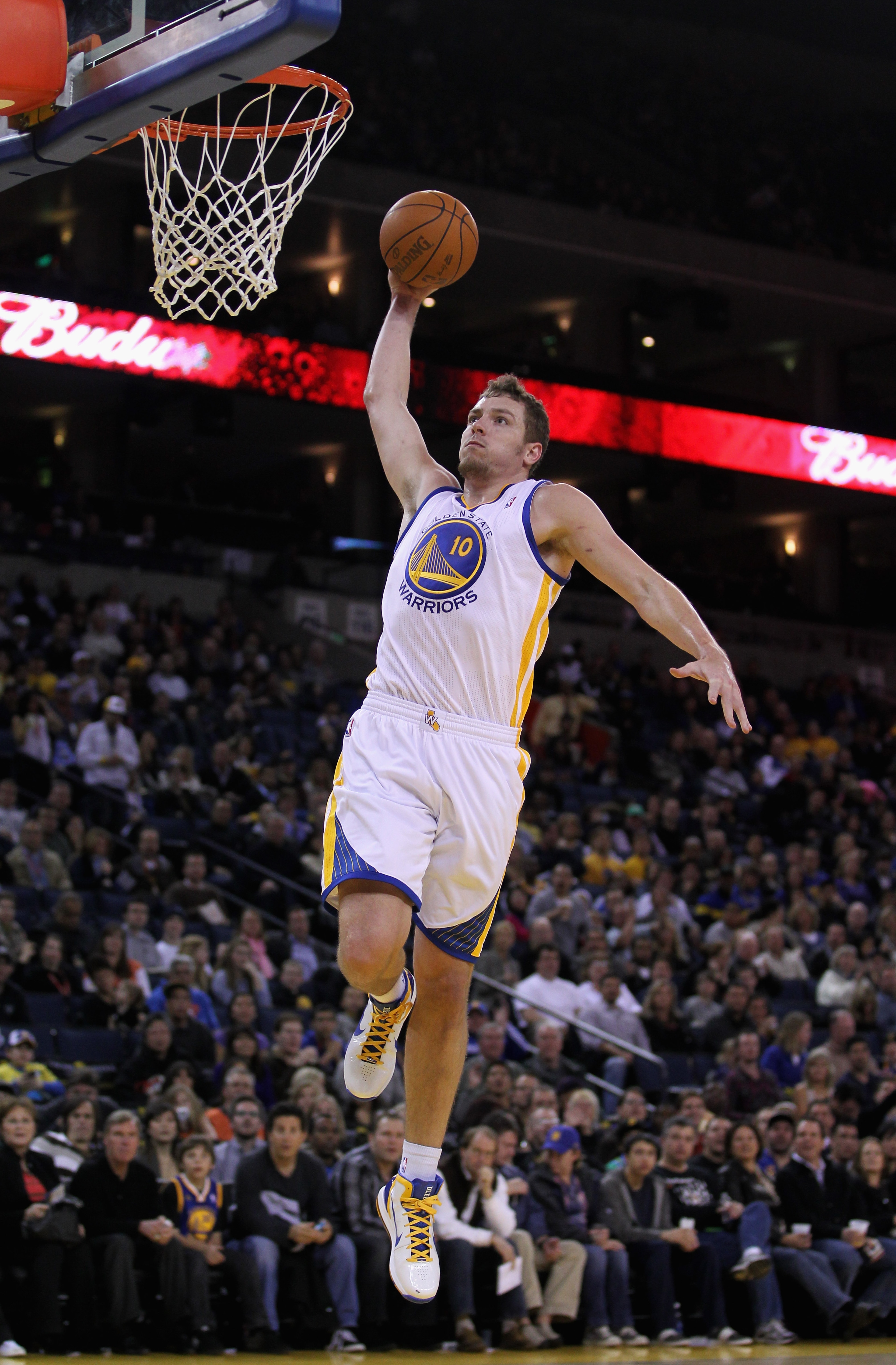 OAKLAND, CA - MARCH 25: David Lee #10 of the Golden State Warriors goes up for a dunk against the Toronto Raptors at Oracle Arena on March 25, 2011 in Oakland, California. NOTE TO USER: User expressly acknowledges and agrees that, by downloading and or us OAKLAND, CA - MARCH 25: David Lee #10 of the Golden State Warriors goes up for a dunk against the Toronto Raptors at Oracle Arena on March 25, 2011 in Oakland, California. NOTE TO USER: User expressly acknowledges and agrees that, by downloading and or us
