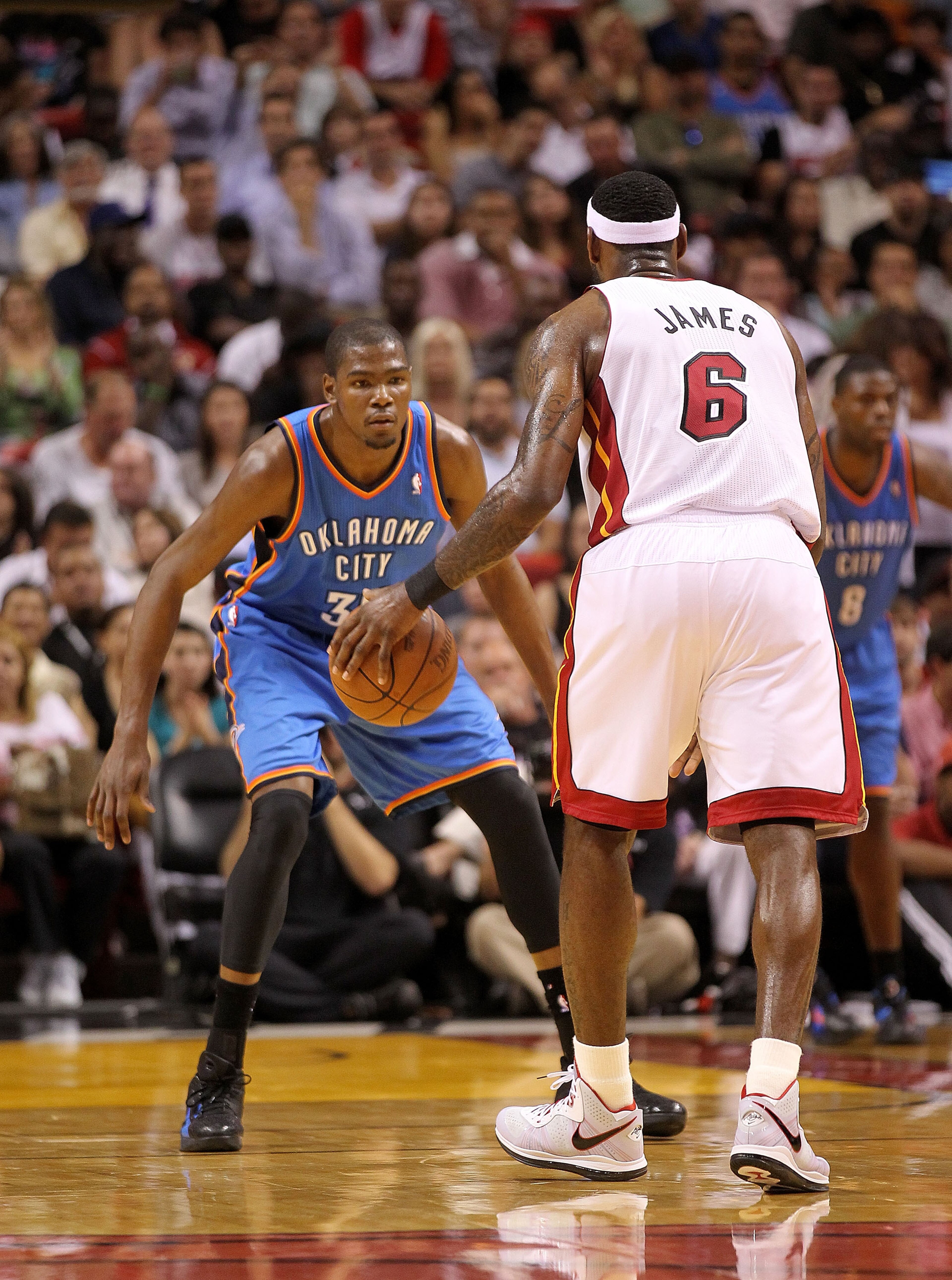 MIAMI, FL - MARCH 16: LeBron James #6 of the Miami Heat is guarded by Kevin Durant #35 of the Oklahoma City Thunder during a game at American Airlines Arena on March 16, 2011 in Miami, Florida. NOTE TO USER: User expressly acknowledges and agrees that, by MIAMI, FL - MARCH 16: LeBron James #6 of the Miami Heat is guarded by Kevin Durant #35 of the Oklahoma City Thunder during a game at American Airlines Arena on March 16, 2011 in Miami, Florida. NOTE TO USER: User expressly acknowledges and agrees that, by