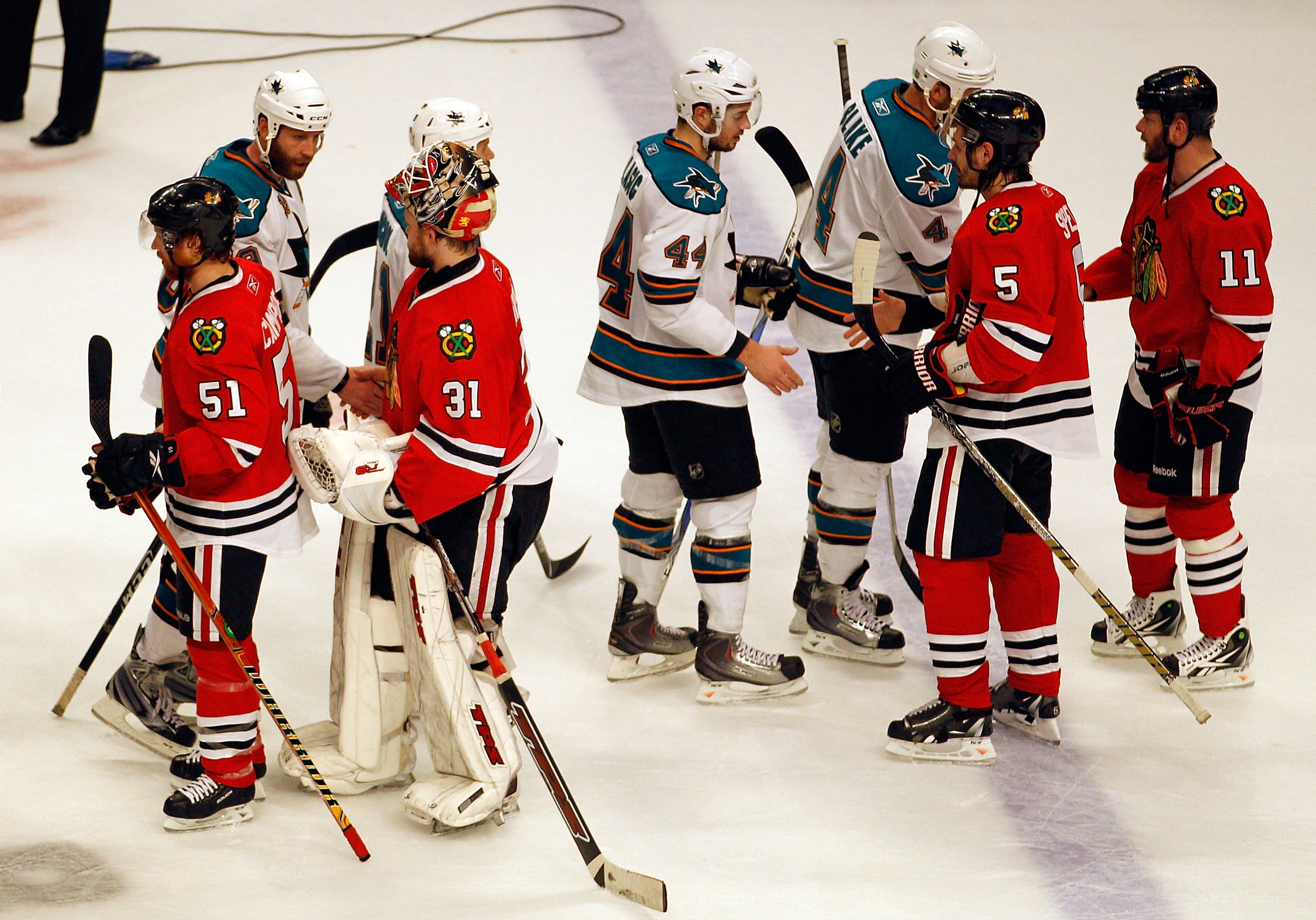 CHICAGO - MAY 23:  The Chicago Blackhawks shake hands with San Jose Sharks players after the Blackhawks 4-2 victory to advance to the Stanley Cup after winning Game Four of the Western Conference Finals during the 2010 NHL Stanley Cup Playoffs at the Unit