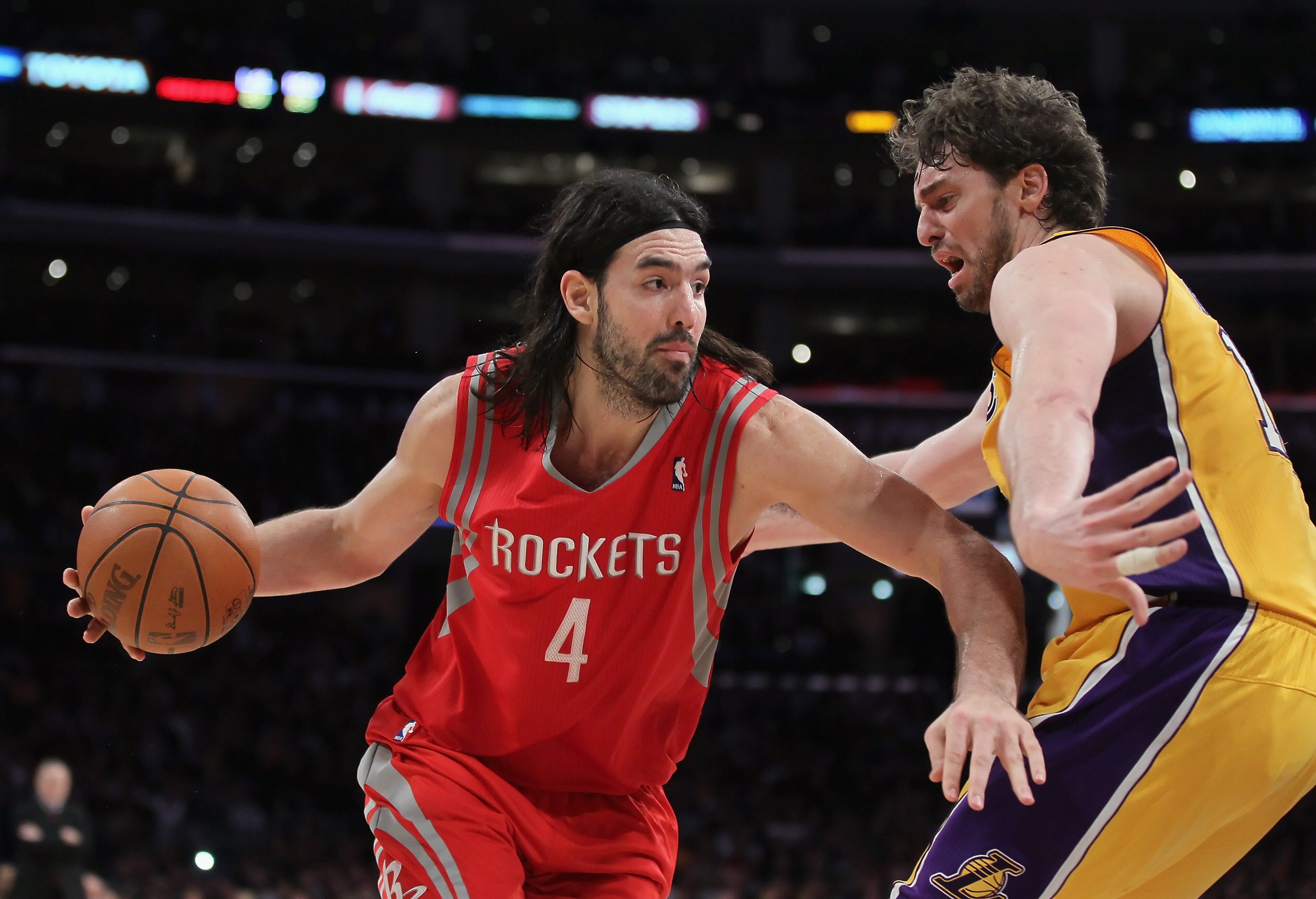 LOS ANGELES, CA - FEBRUARY 01: Luis Scola #4 of the Houston Rockets is defended by Pau Gasol #16 of the Los Angeles Lakers in the second half at Staples Center on February 1, 2011 in Los Angeles, California. The Lakers defeated the Rockets 114-106. NOTE LOS ANGELES, CA - FEBRUARY 01: Luis Scola #4 of the Houston Rockets is defended by Pau Gasol #16 of the Los Angeles Lakers in the second half at Staples Center on February 1, 2011 in Los Angeles, California. The Lakers defeated the Rockets 114-106. NOTE