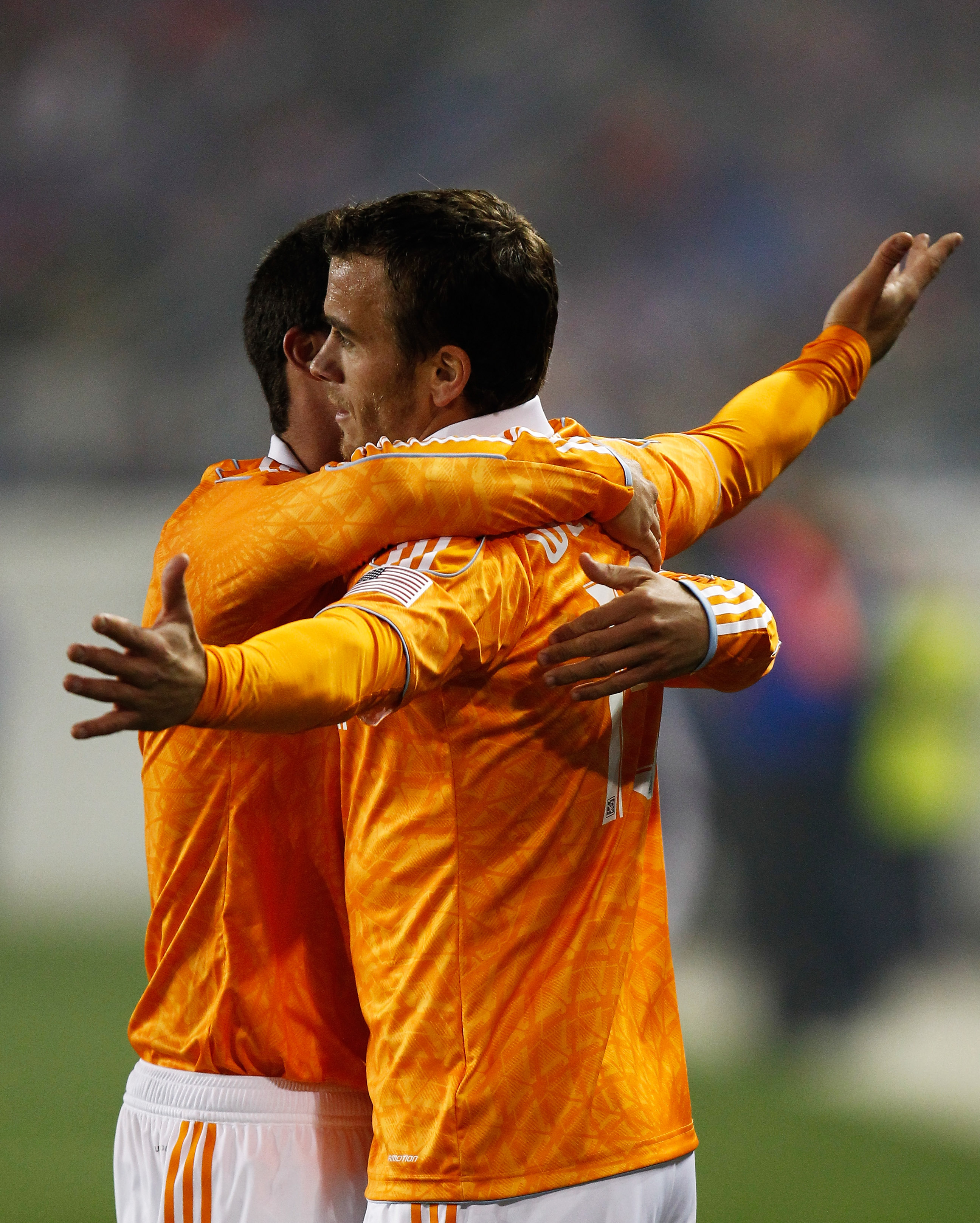 HARRISON, NJ - APRIL 02:  Cameron Weaver #15 of the Houston Dynamo celebrates his game-tying goal in the second half against the New York Red Bulls at Red Bull Arena on April 2, 2011 in Harrison, New Jersey.  (Photo by Jeff Zelevansky/Getty Images)