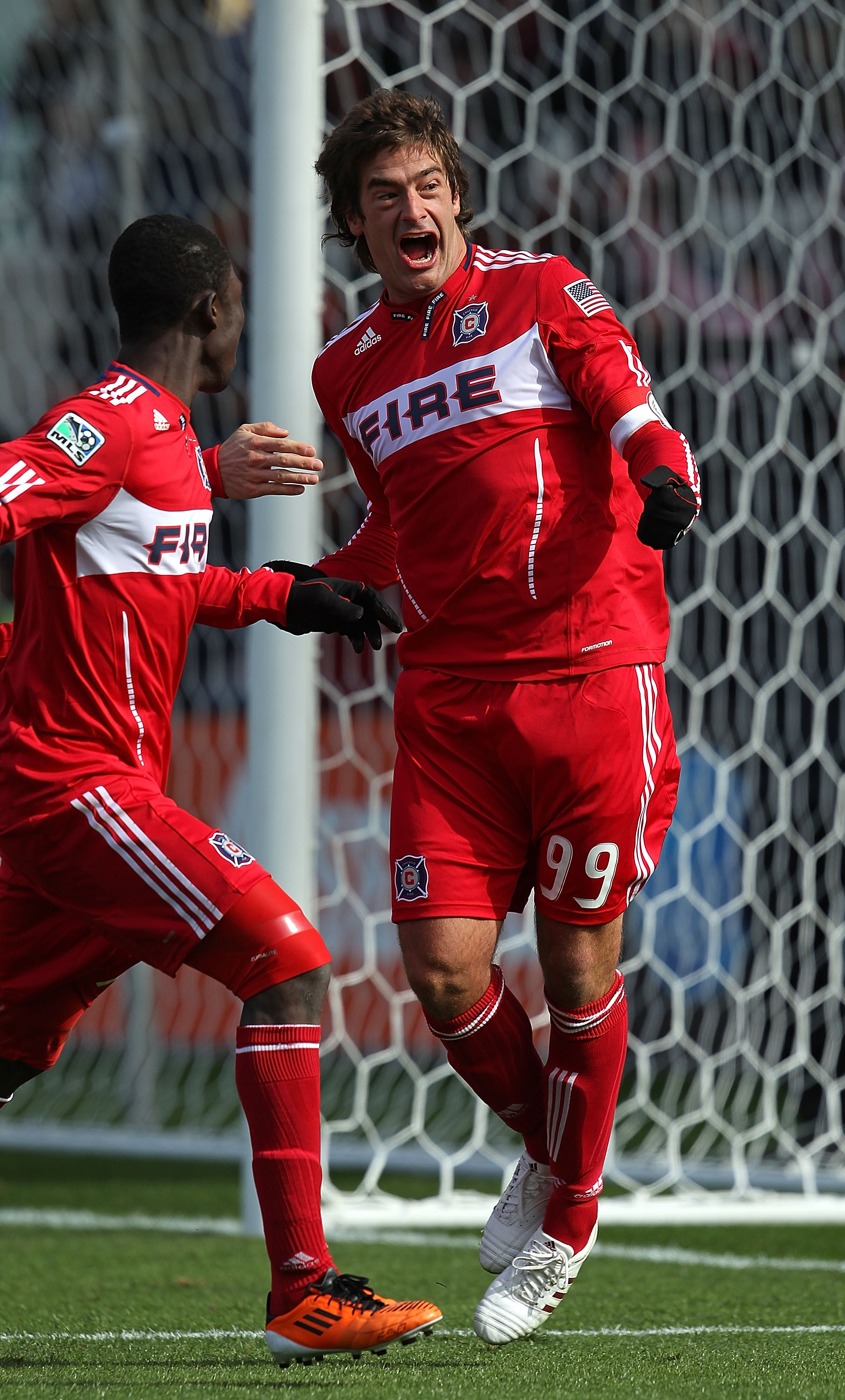 BRIDGEVIEW, IL - MARCH 26: Diego Chaves #99 of the Chicago Fire celebrates a penalty kick goal with teammate Patrick Nyarko #14 against Sporting Kansas City during an MLS match at Toyota Park on March 26, 2010 in Bridgeview, Illinois. The Fire defeated Sp