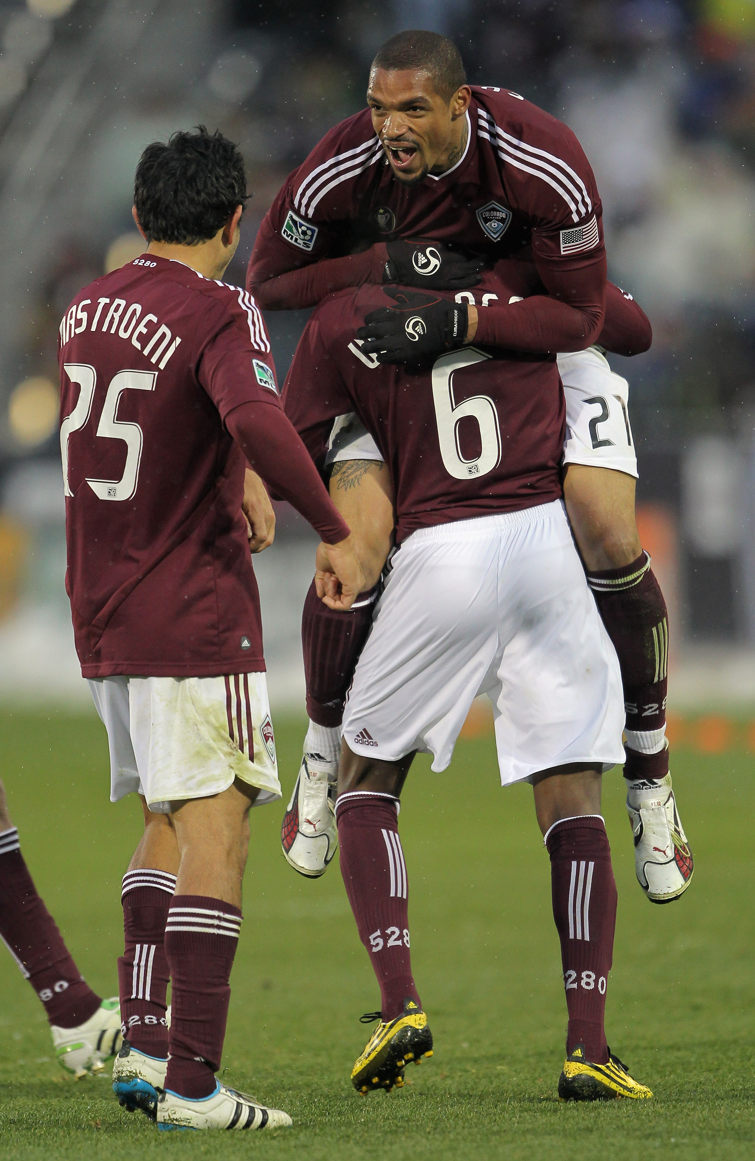 COMMERCE CITY, CO - APRIL 03:  Caleb Folan #21 of the Colorado Rapids is lifted up by Anthony Wallace #6 as Pablo Mastroeni #25 watches as they celebrate Folan's goal in the 81st minute against D.C. United at Dick's Sporting Goods Park on April 3, 2011 in