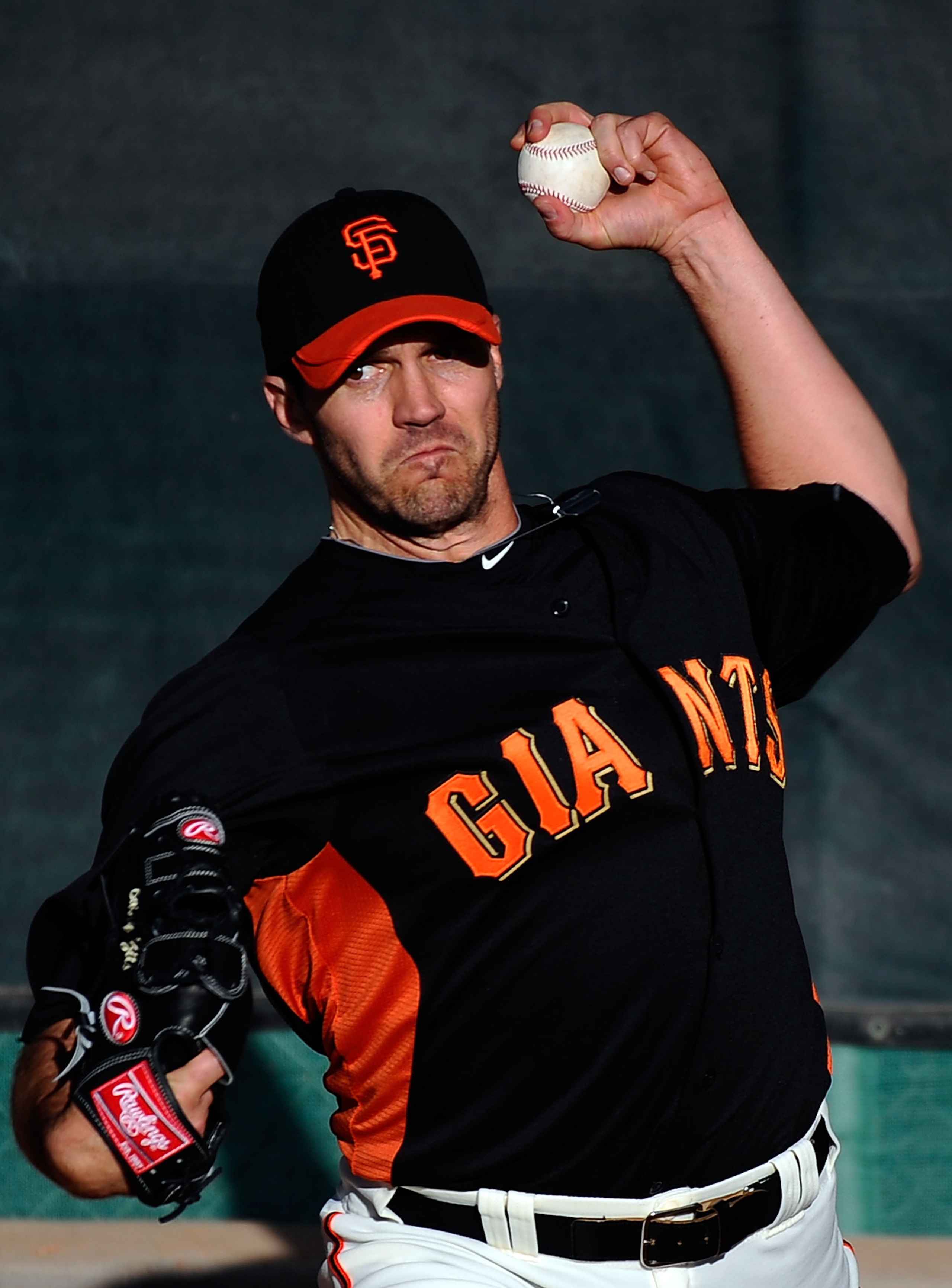 SCOTTSDALE, AZ - MARCH 07:  Pitcher Barry Zito #75 of the San Francisco Giants thorws a pitch in the bullpen prior to the start of the spring training baseball game against the Texas Rangers in the first meeting between the two teams since the World Serie