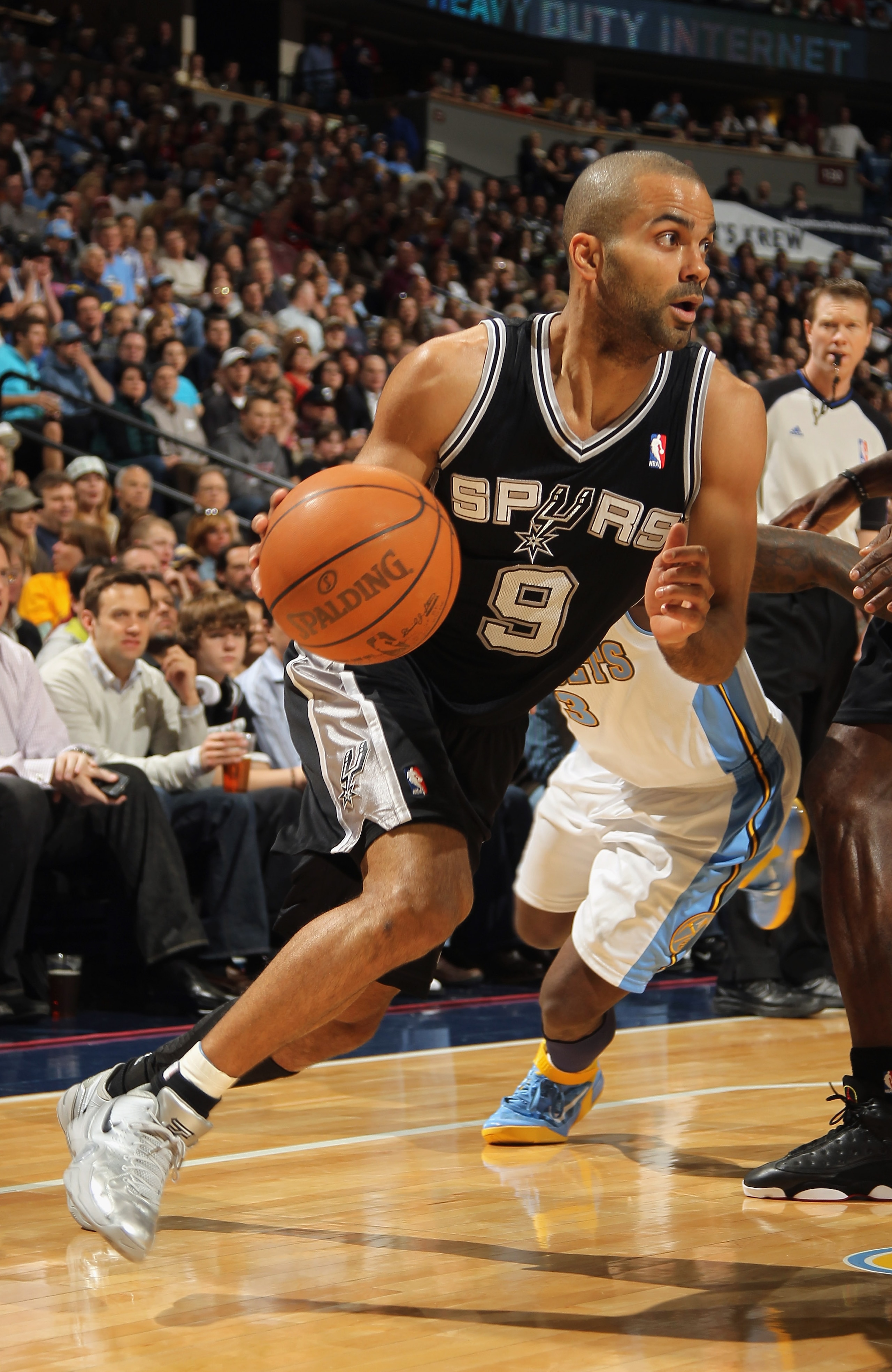 DENVER, CO - MARCH 23:  Tony Parker #9 of the San Antonio Spurs dribbles the ball against  the Denver Nuggets at the Pepsi Center on March 23, 2011 in Denver, Colorado. The Nuggets defeated the Spurs 115-112. NOTE TO USER: User expressly acknowledges and