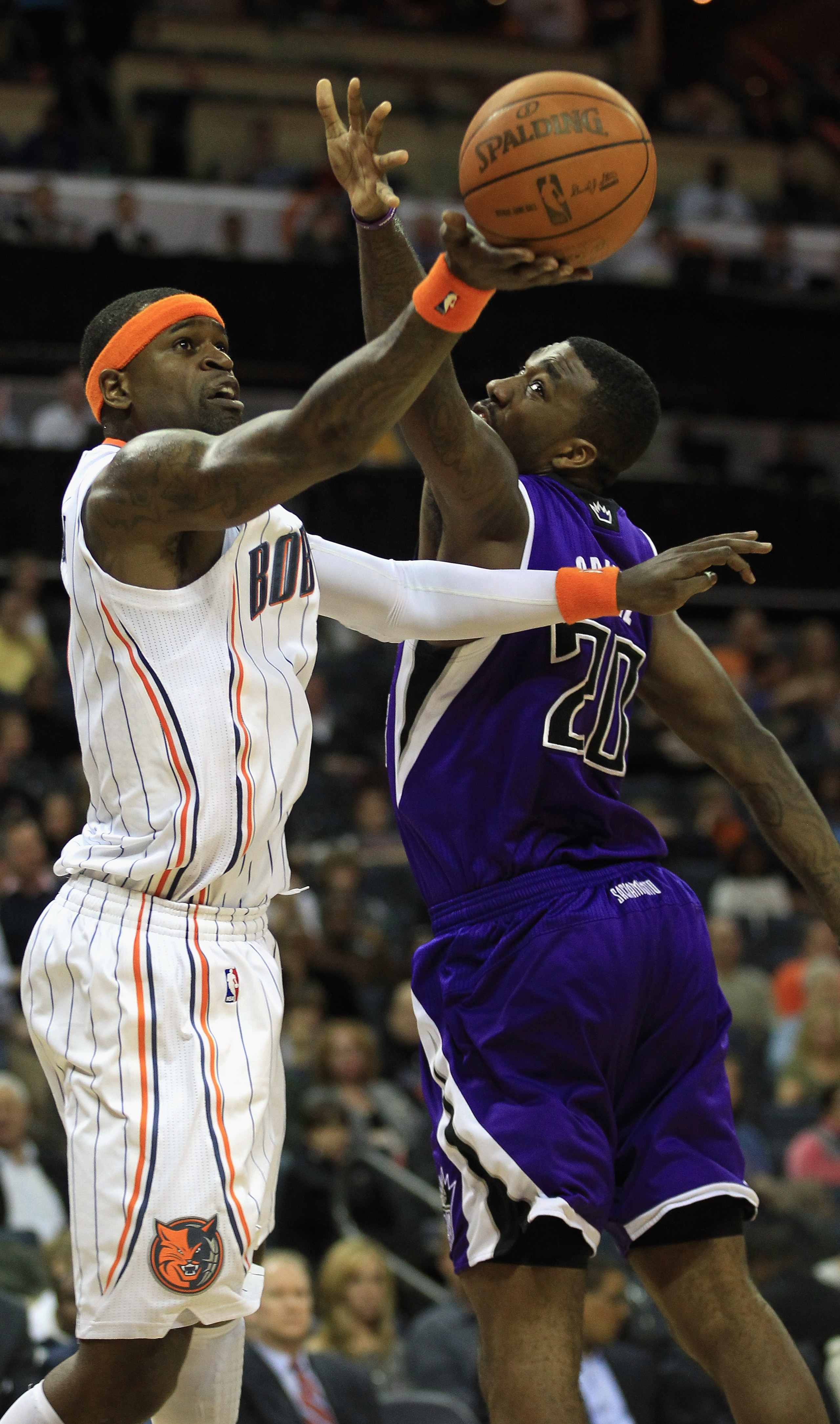 CHARLOTTE, NC - FEBRUARY 25: Donte Greene #20 of the Sacramento Kings tries to stop Stephen Jackson #1 of the Charlotte Bobcats during their game at Time Warner Cable Arena on February 25, 2011 in Charlotte, North Carolina. NOTE TO USER: User expressly a CHARLOTTE, NC - FEBRUARY 25: Donte Greene #20 of the Sacramento Kings tries to stop Stephen Jackson #1 of the Charlotte Bobcats during their game at Time Warner Cable Arena on February 25, 2011 in Charlotte, North Carolina. NOTE TO USER: User expressly a